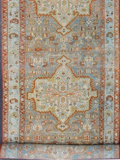 Antique Persian Malayer Runner Featuring Soft Blue and Terracotta Medallions