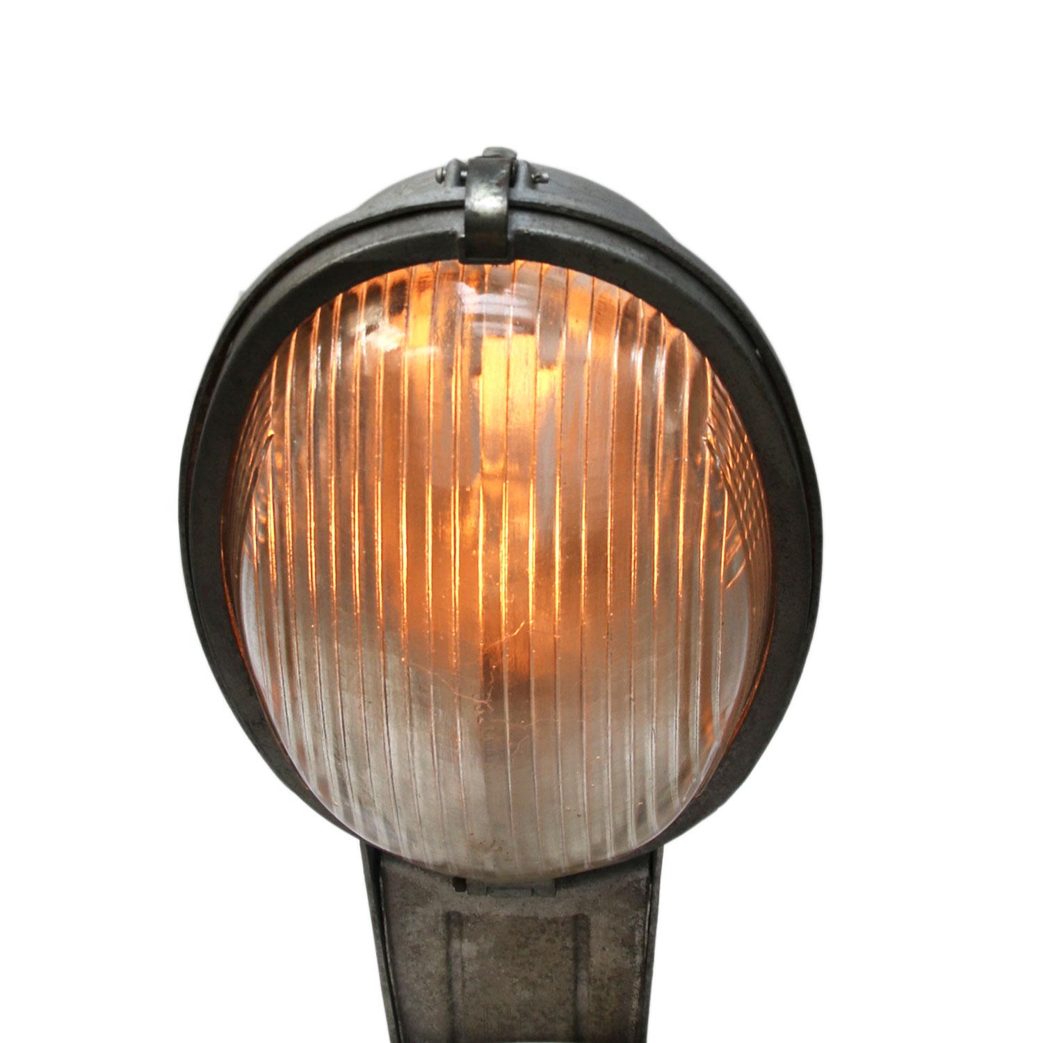 Industrial Street wall light.
Cast aluminium body with round Holophane glass.

Measure: Weight 7.4 kg / 16.3 lb

Priced per individual item. All lamps have been made suitable by international standards for incandescent light bulbs, energy-efficient