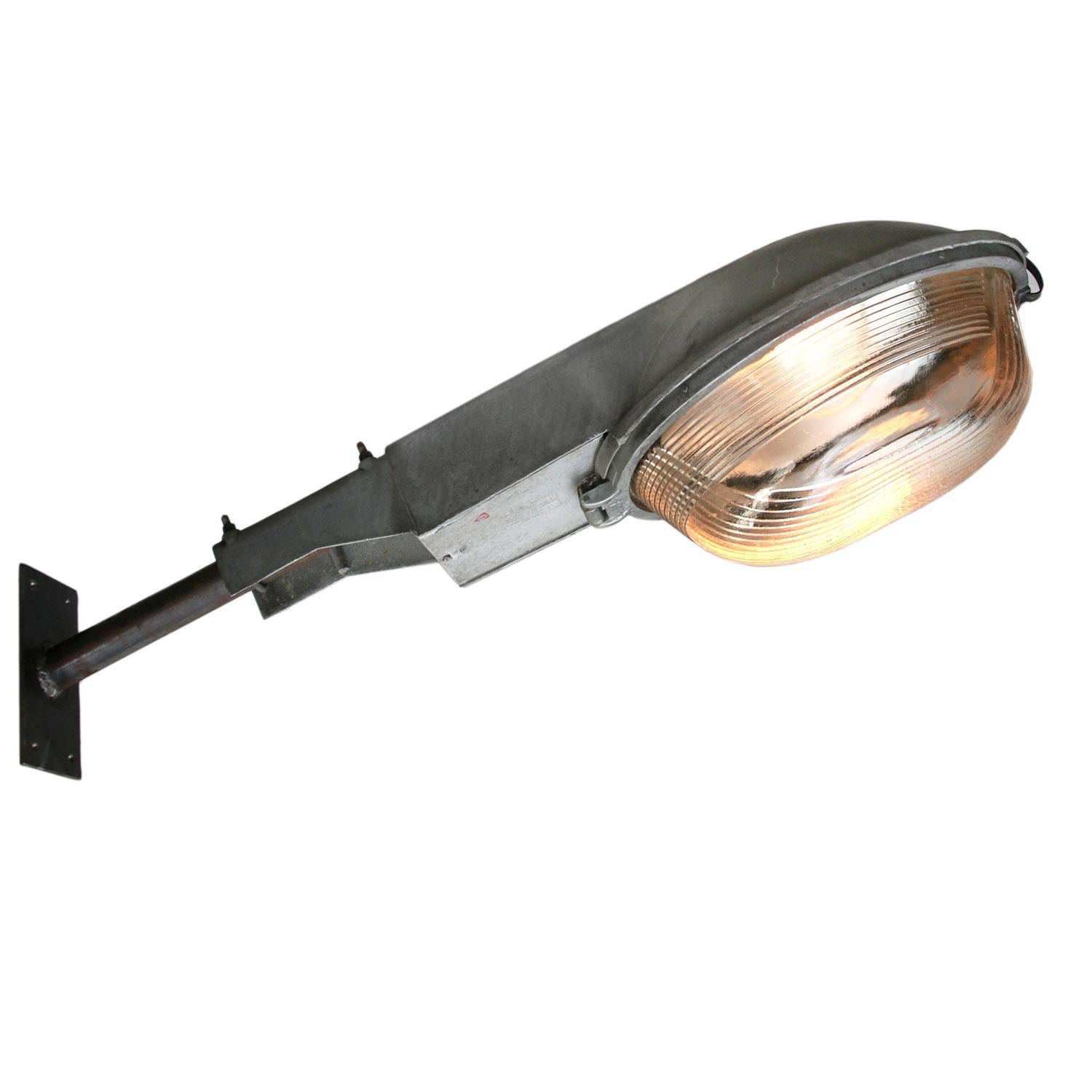 Industrial street wall light.
Aluminium body with round Holophane glass.

Weight 7.00 kg / 15.4 lb

Priced per individual item. All lamps have been made suitable by international standards for incandescent light bulbs, energy-efficient and LED