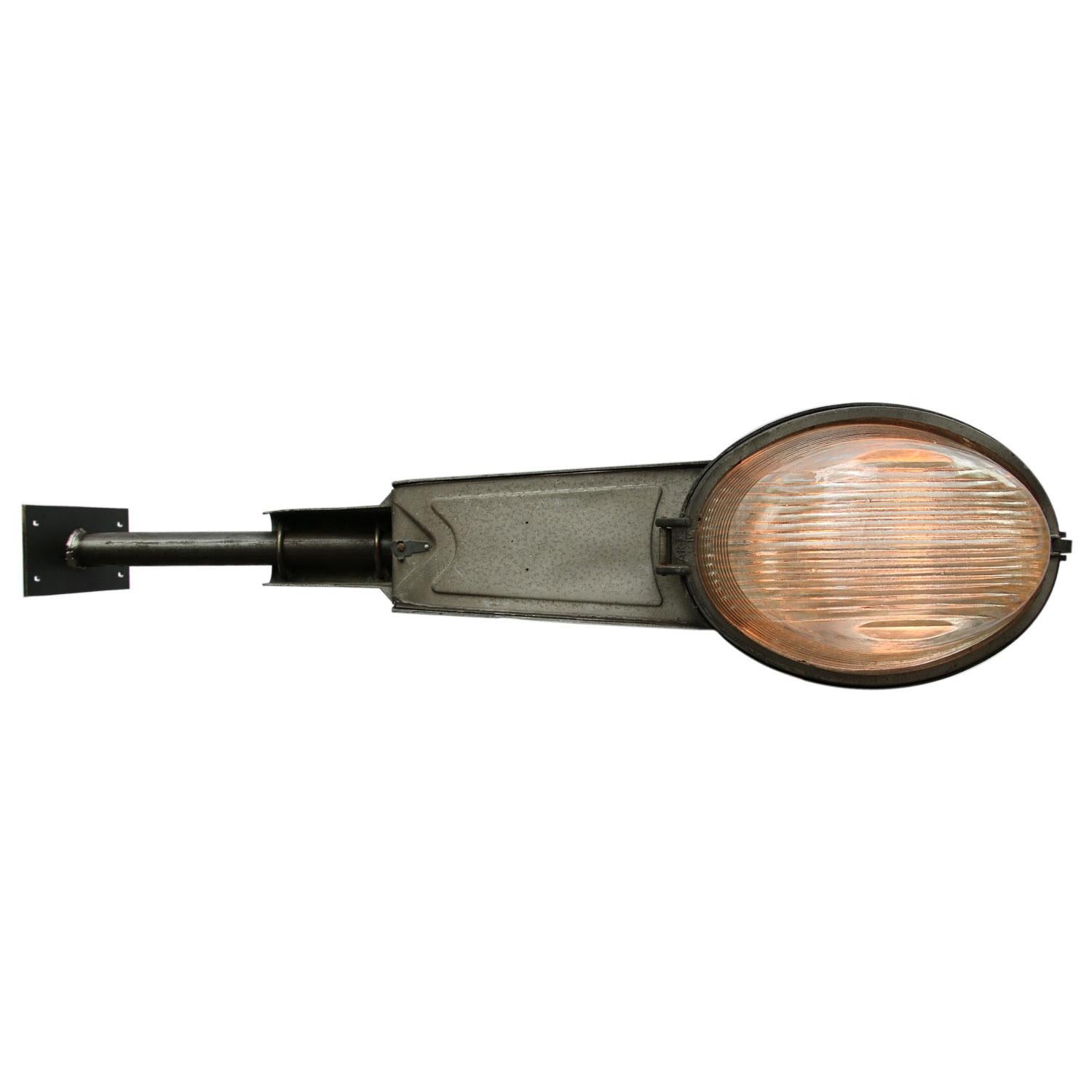 Large street wall light.
Aluminium body with round Holophane glass.

Weight 7.00 kg / 15.4 lb

Priced per individual item. All lamps have been made suitable by international standards for incandescent light bulbs, energy-efficient and LED