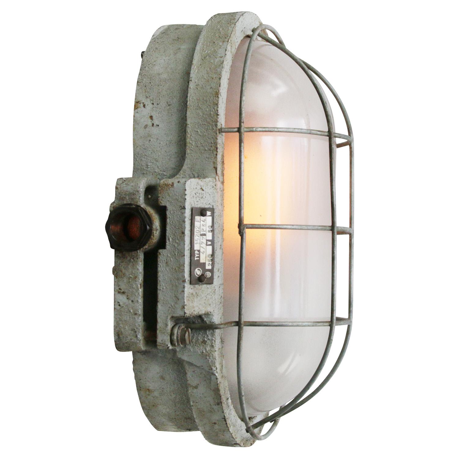 Industrial wall lamp, scone, flush mount. 
Grey cast iron. Frosted glass.

Weight: 6.0 kg / 13.2 lb

Priced per individual item. All lamps have been made suitable by international standards for incandescent light bulbs, energy-efficient and LED