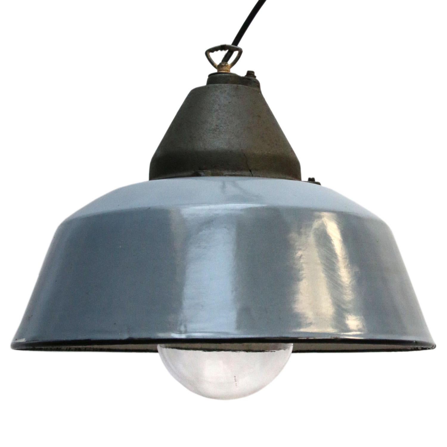 Factory hanging lamp. Gray enamel. White interior.
Clear glass. Cast iron top.

Weight: 5.5 kg / 12.1 lb

Priced per individual item. All lamps have been made suitable by international standards for incandescent light bulbs, energy-efficient