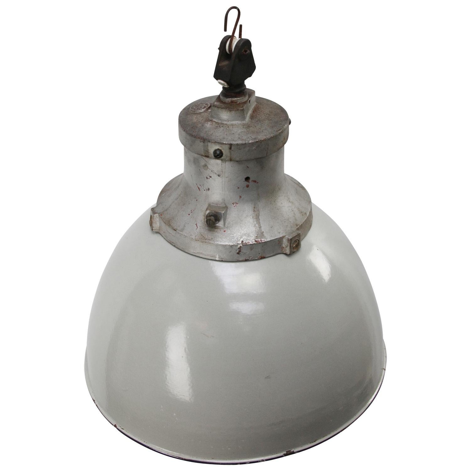 Rare and old factory lamp by Industria Rotterdam
Grey enamel with gray cast iron top
white interior

Weight: 5.40 kg / 11.9 lb

Priced per individual item. All lamps have been made suitable by international standards for incandescent light