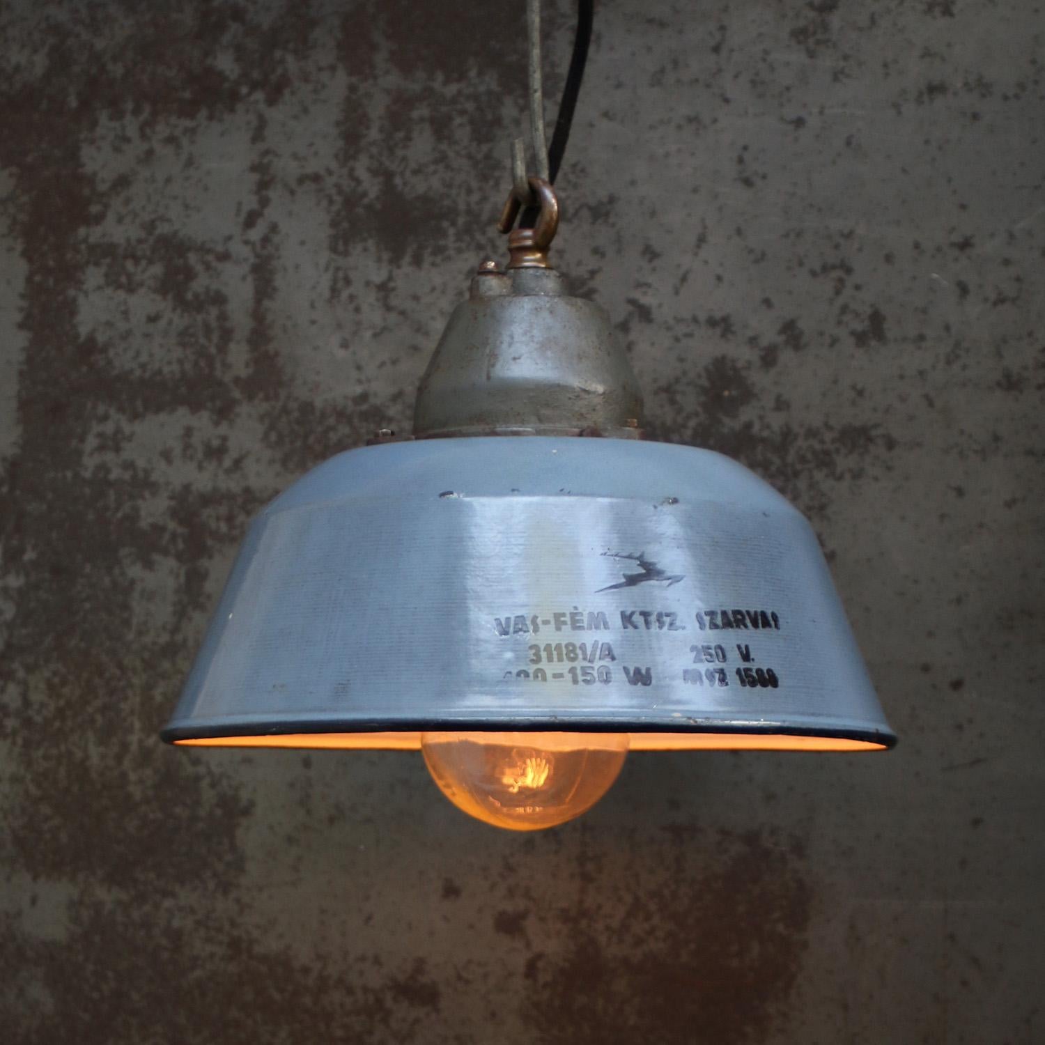 Factory pendant. Grey enamel, white interior. Cast iron top with clear glass.

Weight 3.4 kg / 7.5 lb

Priced per individual item. All lamps have been made suitable by international standards for incandescent light bulbs, energy-efficient and LED
