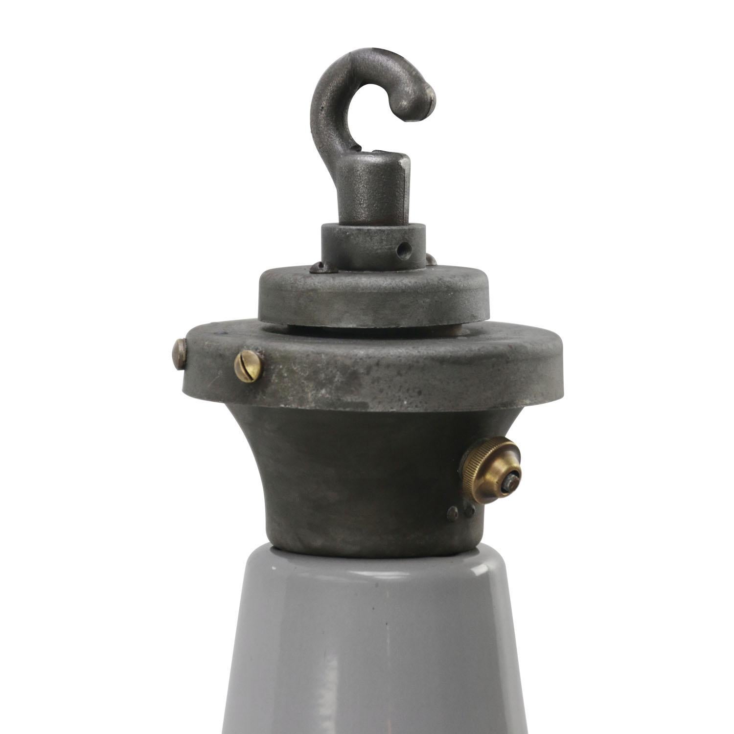 British industrial vintage pendants by Benjamin, RLM, UK
gray enamel with white inside
cast iron top

Weight 2.70 kg / 6 lb

Priced per individual item. All lamps have been made suitable by international standards for incandescent light bulbs,