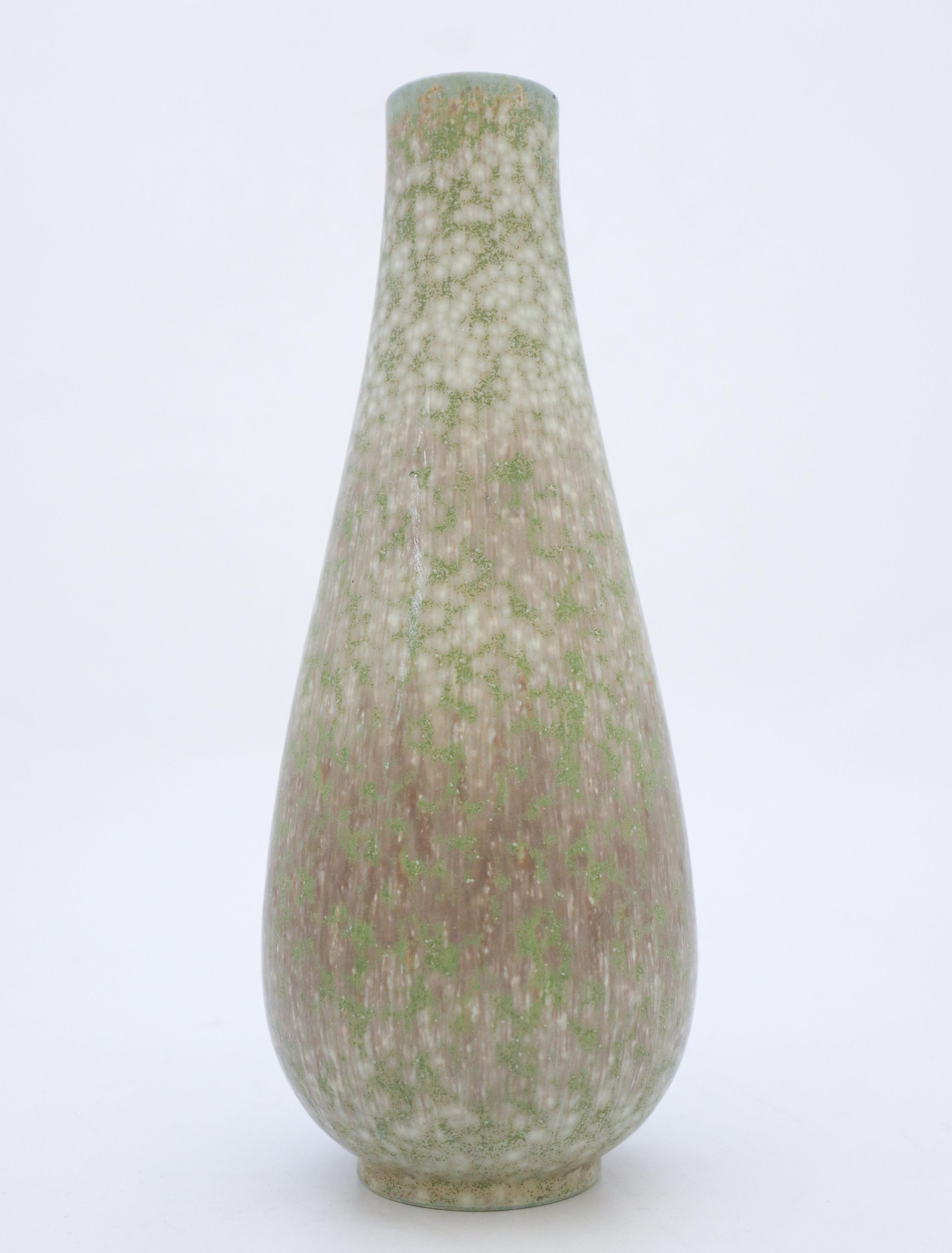 A lovely gray and green vase designed by Gunnar Nylund at Rörstrand, it´s 28 cm high and it has a lovely glaze, it´s in excellent condition except from a mark in the glaze from the production, why it is marked as 2nd quality.

Gunnar Nylund was