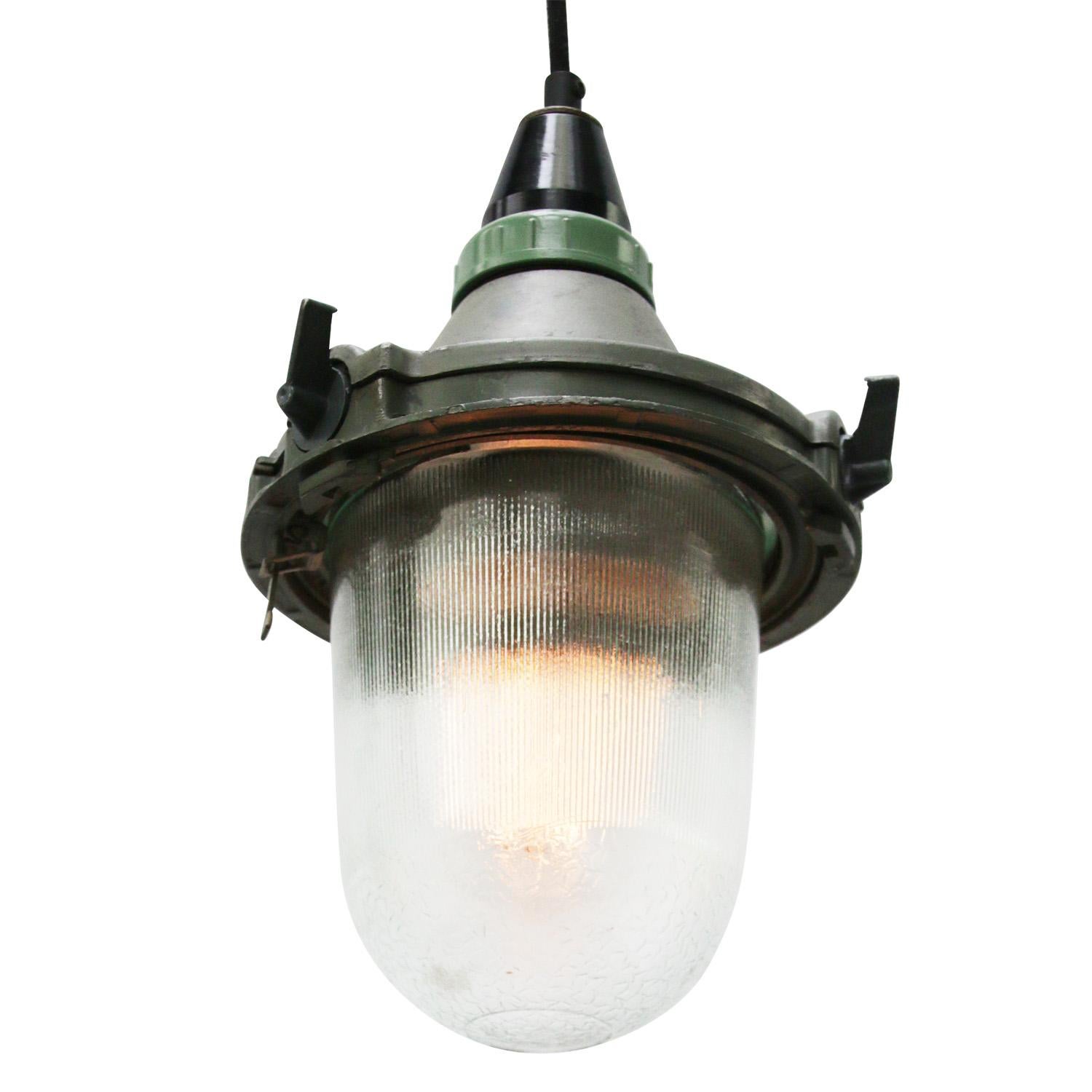 Grey green industrial pendant.
Aluminum with Bakelite top.
Clear striped glass. 

Weight: 1.00 kg / 2.2 lb

Priced per individual item. All lamps have been made suitable by international standards for incandescent light bulbs, energy-efficient