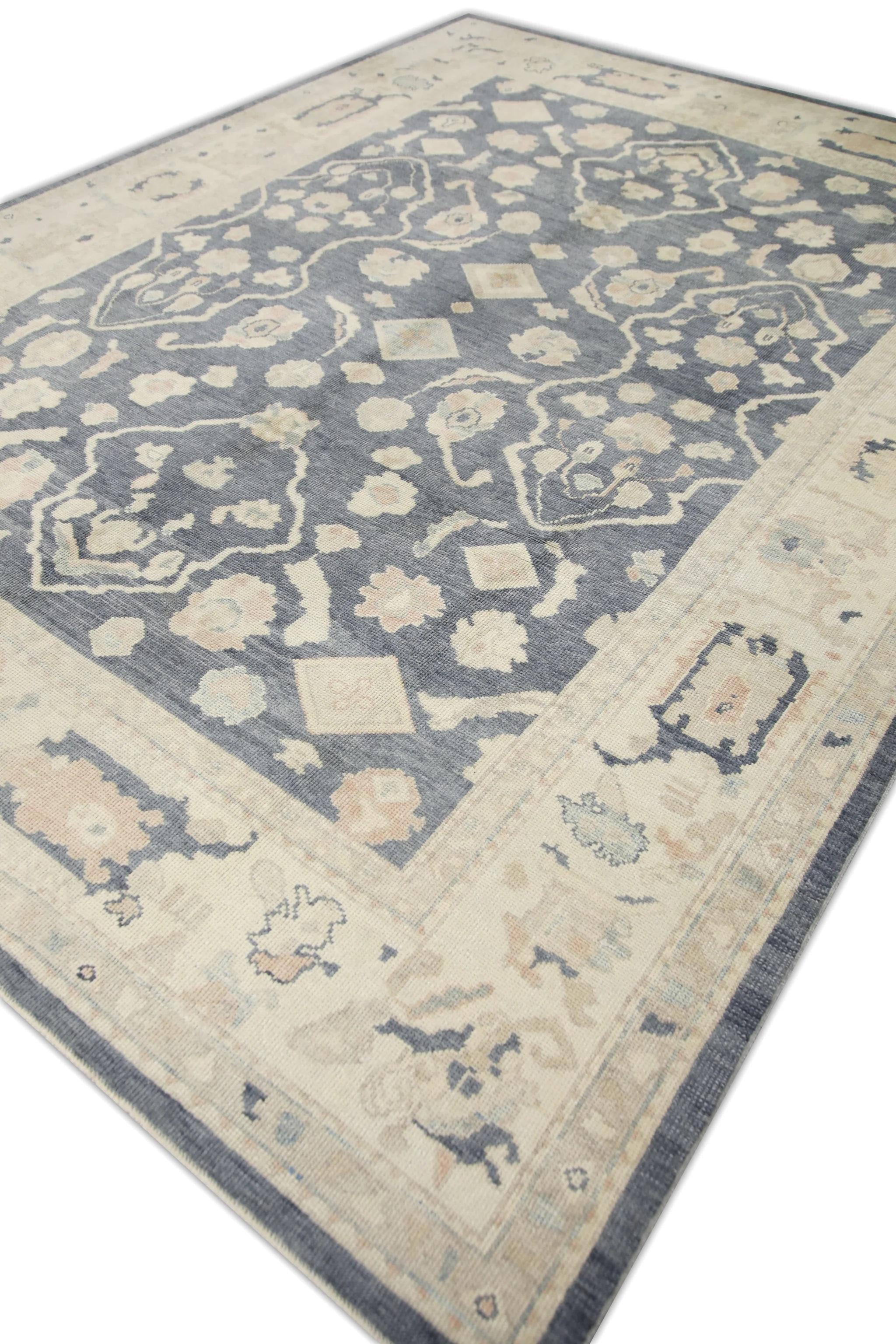 This Turkish oushak rug is a stunning piece of art that has been handwoven using traditional techniques by skilled artisans. The rug features intricate patterns and a soft color palette that is achieved through the use of natural vegetable