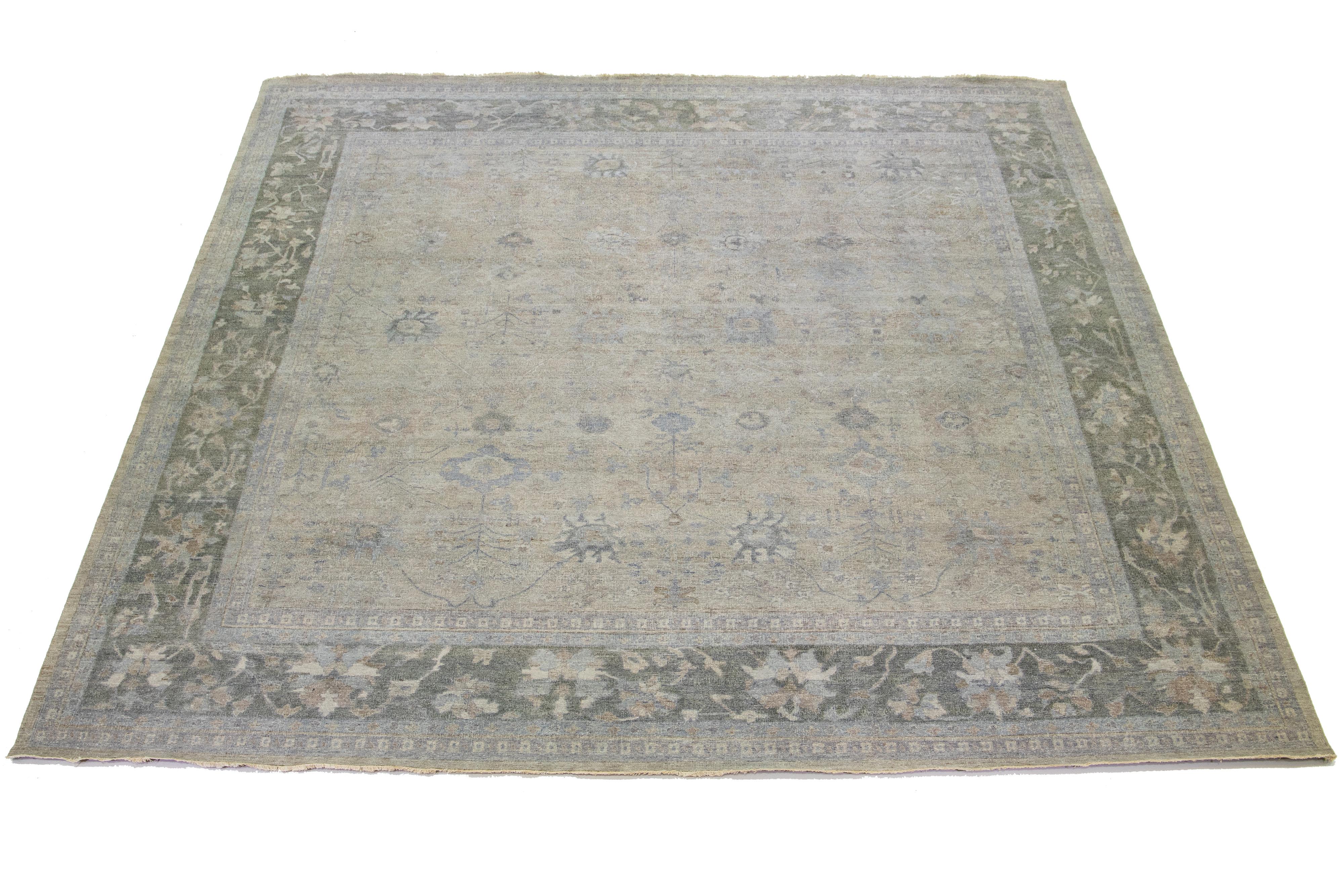 The Artisan line from Apadana brings an exquisite antique style to any space. This hand-knotted square rug showcases a beautiful all-over floral pattern with a gray color scheme and blue and brown accents. It measures 14' 7