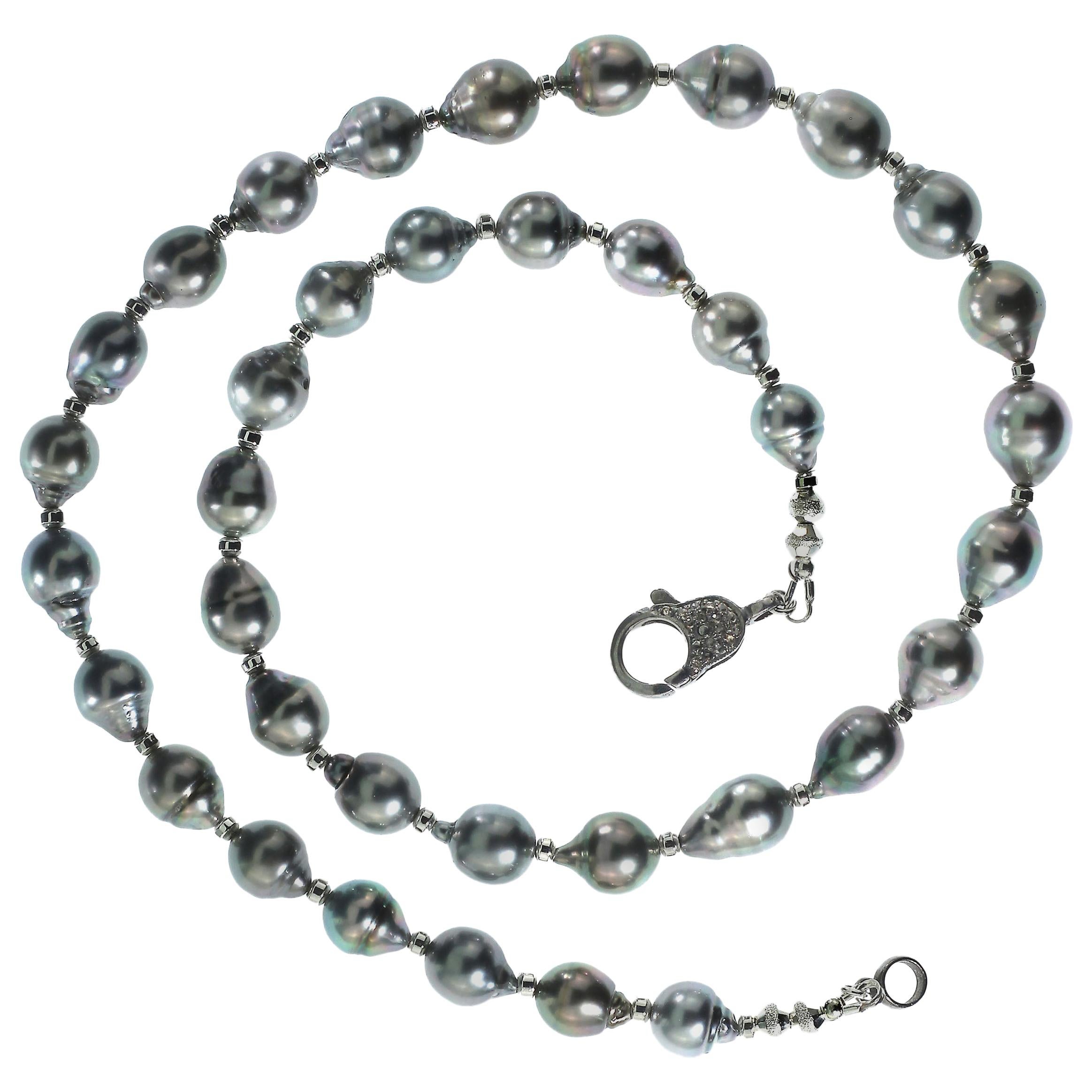 'Nothing gives the luxury of Pearls. Keep them in mind.' Diana Vreeland

Elegant, unique silver Tahitian Pearl necklace to grace your neck. This one of a kind 21 inch necklace is a 'must have' for all pearl lovers. Sparkling silver accents enhance