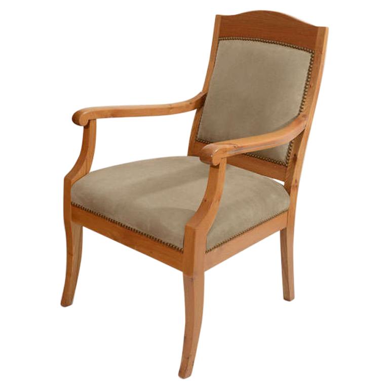 The high upholstered back combined with wide and deep seat exemplify the Classic and comfortable Scandinavian Art Nouveau design. Sophisticated while still cozy and solid, this smooth chair sacrifices nothing! The subdued, neutral tones of the wood