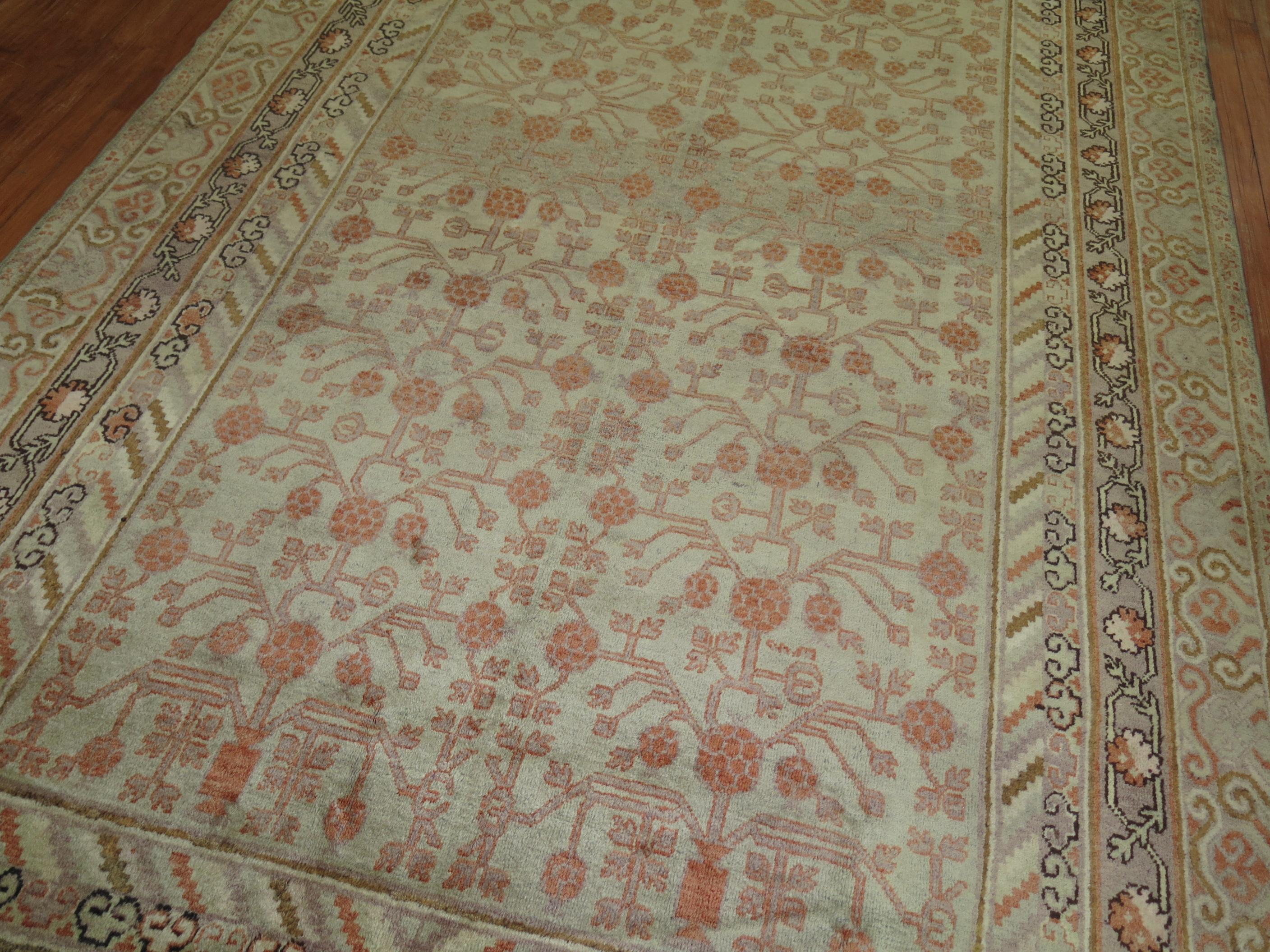 A high Decorative Khotan Gallery size rug with a pomegranate motif on a gray field. Overall even medium pile condition

circa 1910, measures: 6'2