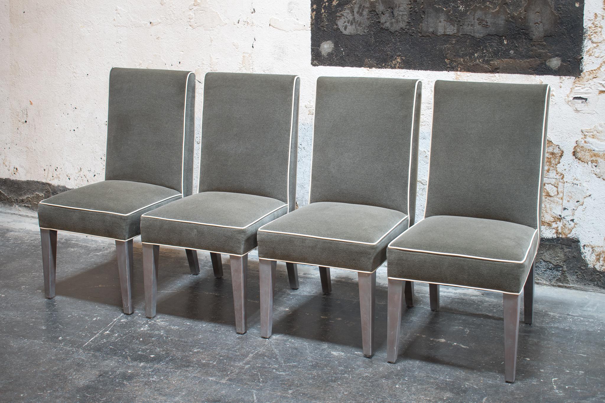 Fabulous set of 4 custom Nils dining chairs in grey mélange fabric with off white ultra leather contrast welt and Swedish grey finish legs. Ready for immediate delivery!.