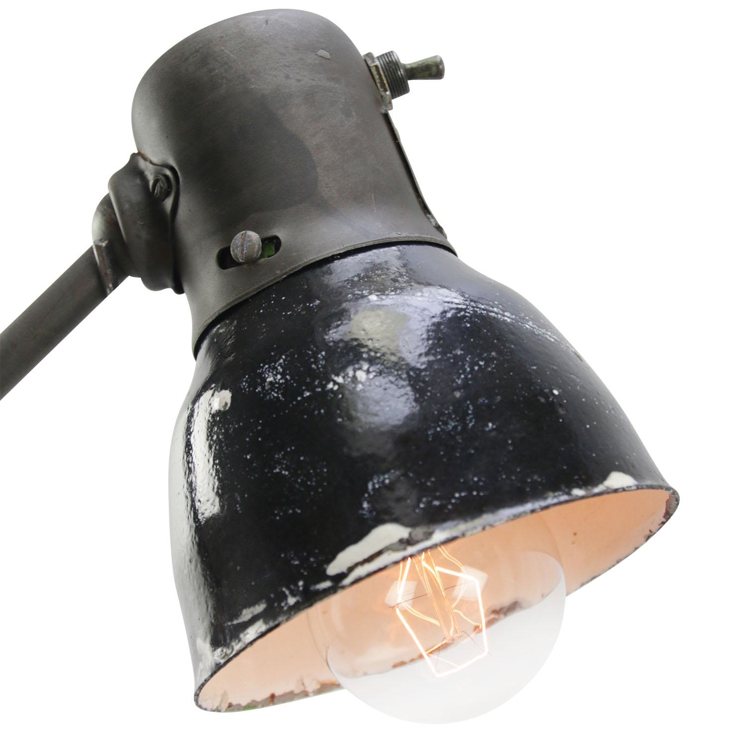 Metal work light / wall lamp with 2 arms.
Black enamel shade
Switch in shade

size foot 8.5×8.5cm

E27/E26

Priced per individual item. All lamps have been made suitable by international standards for incandescent light bulbs,