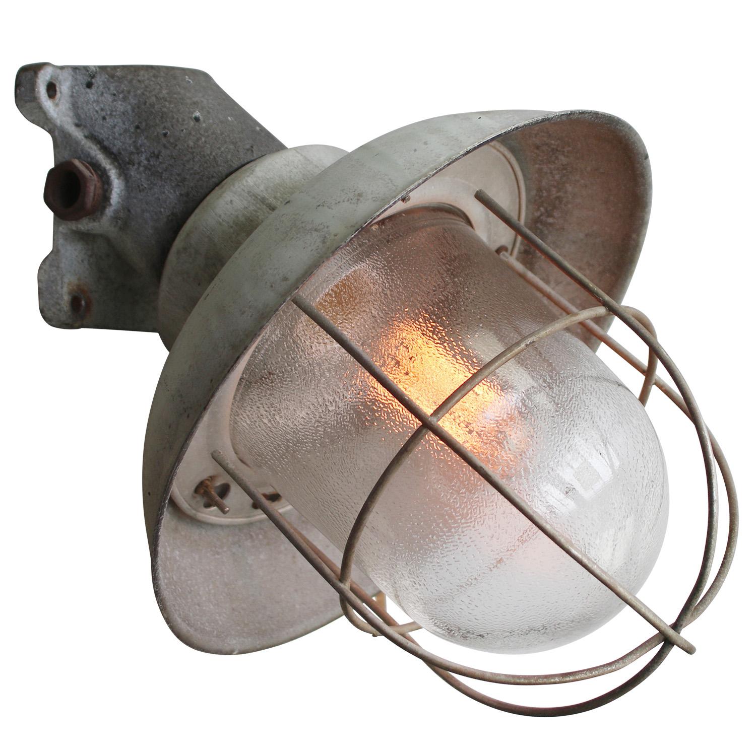 Aluminum industrial pendant lamp
Gray aluminum shade with cast iron base
frosted glass 

Weight: 2.70 kg / 6 lb

Priced per individual item. All lamps have been made suitable by international standards for incandescent light bulbs, energy-efficient