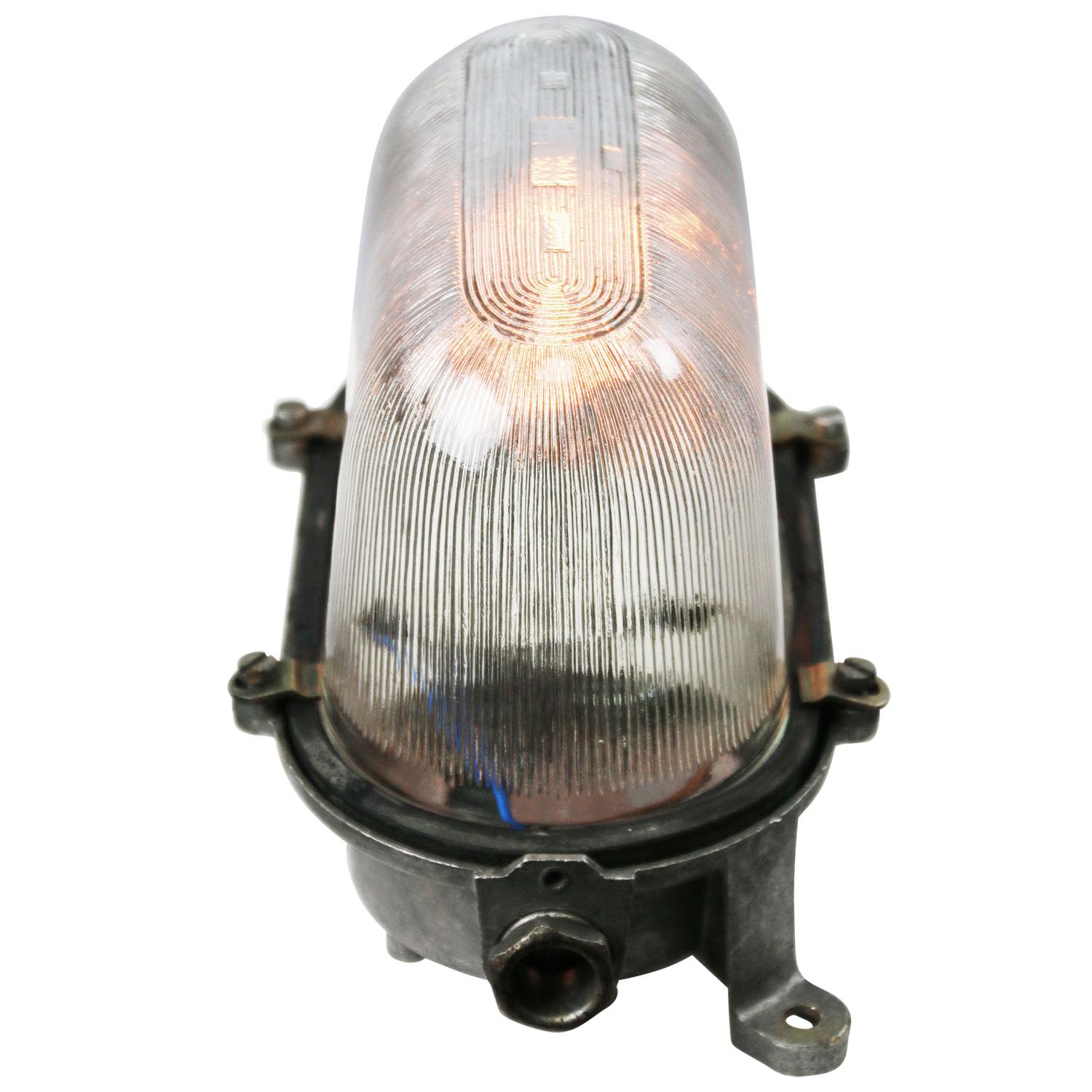 Industrial wall, scone or ceiling lamp
Cast aluminium, Holophane glass

Weight: 1.40 kg / 3.1 lb

Priced per individual item. All lamps have been made suitable by international standards for incandescent light bulbs, energy-efficient and LED