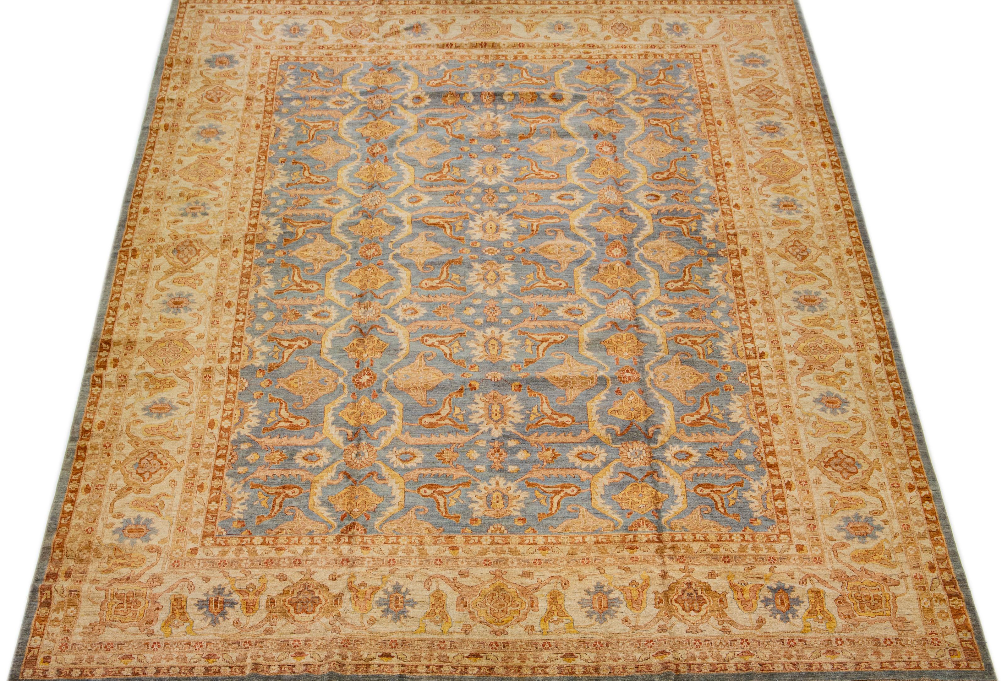 Beautiful Paki Peshawar hand knotted wool rug with a gray color field. This modern rug has rust and golden accents in a Classic all-over floral motif.

This rug measures 12'10