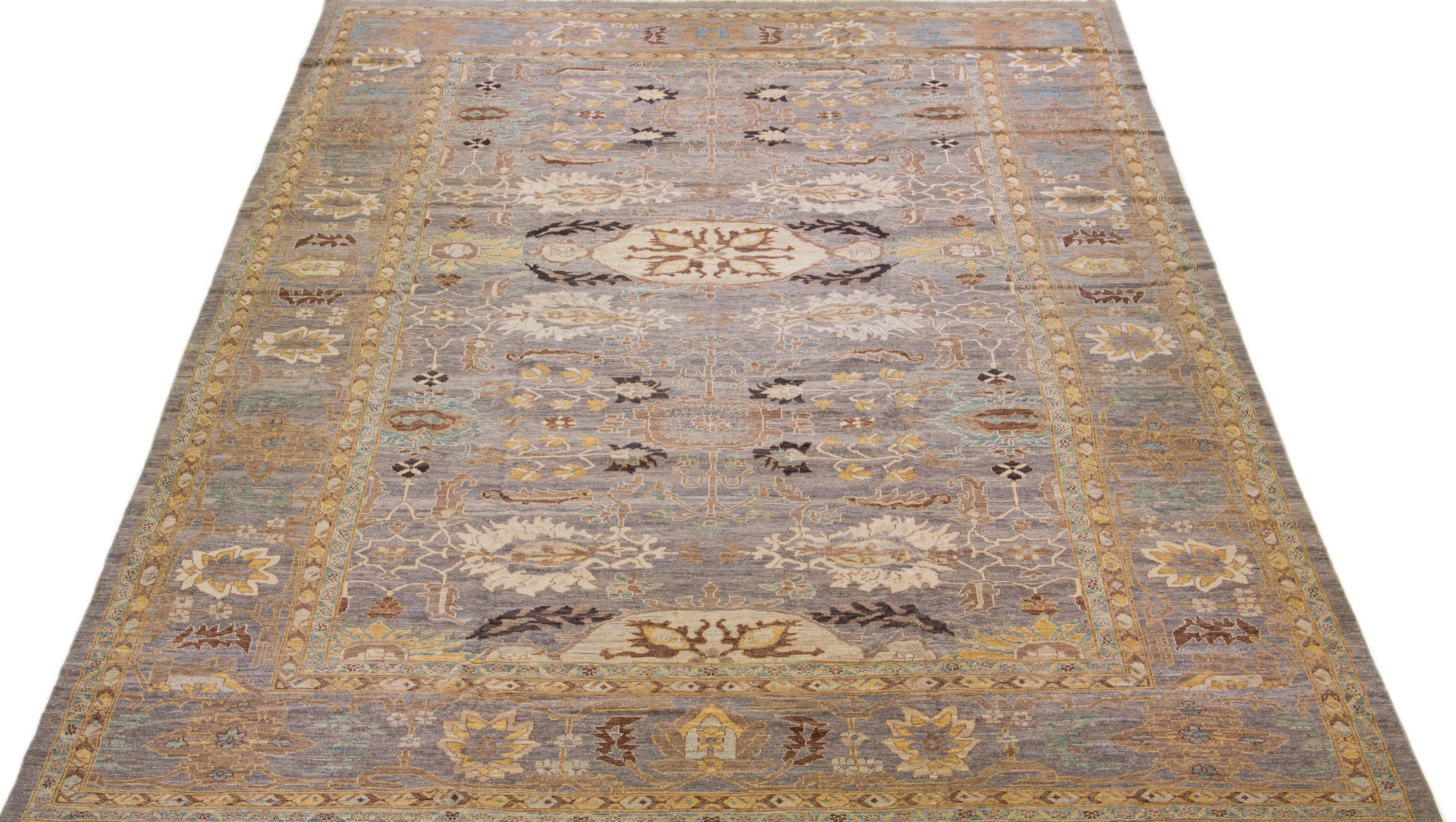 Beautiful modern Sultanabad hand-knotted wool rug with a gray color field. This rug has a designed frame with yellow, blue, and brown accents in a gorgeous all-over floral design.

This rug measures: 13'3