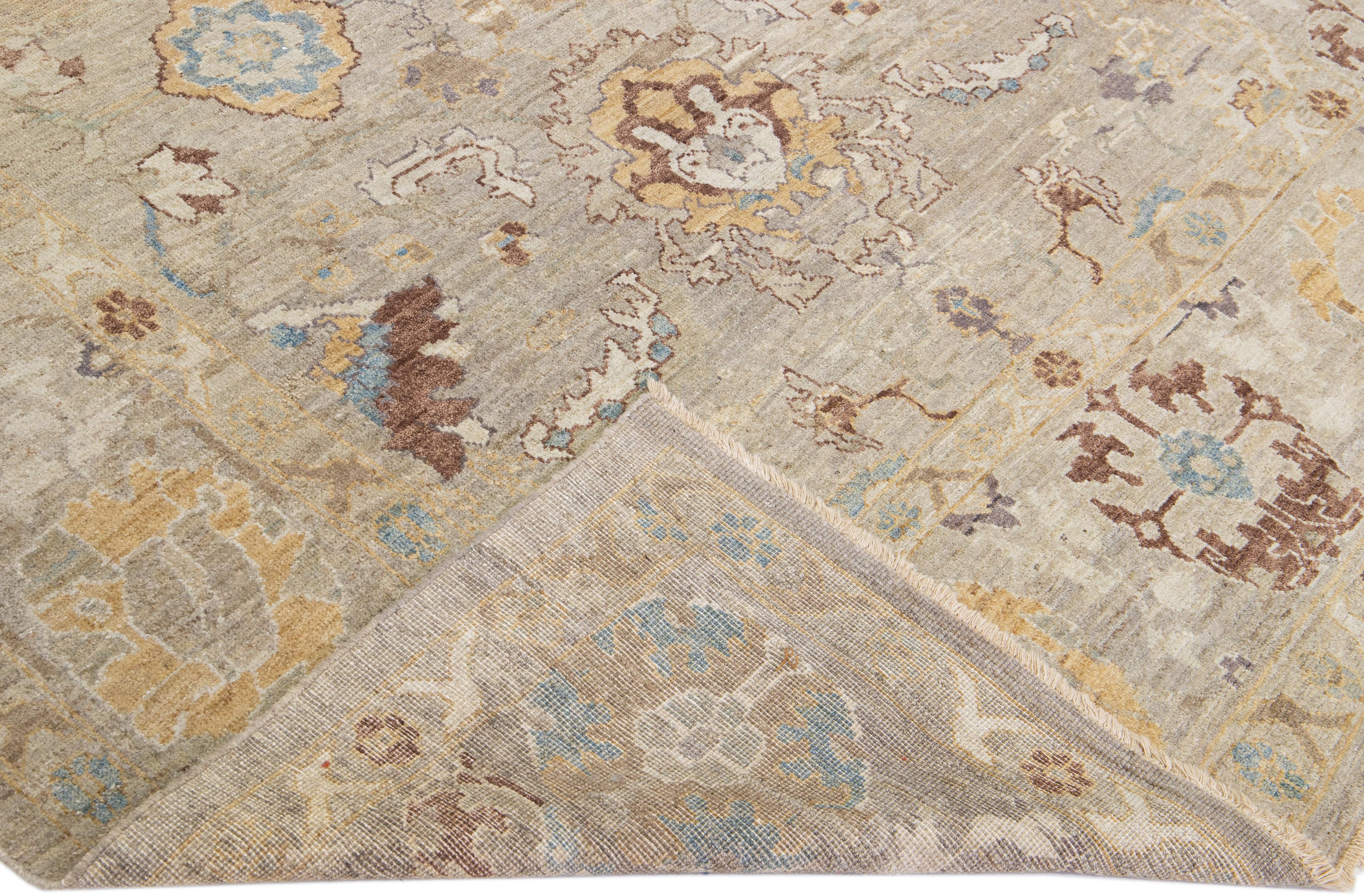 Beautiful modern Sultanabad hand-knotted wool rug with a gray and beige field. This Sultanabad rug has brown, gray, and blue accents in a gorgeous all-over classic floral pattern design.

This rug measures: 7'9