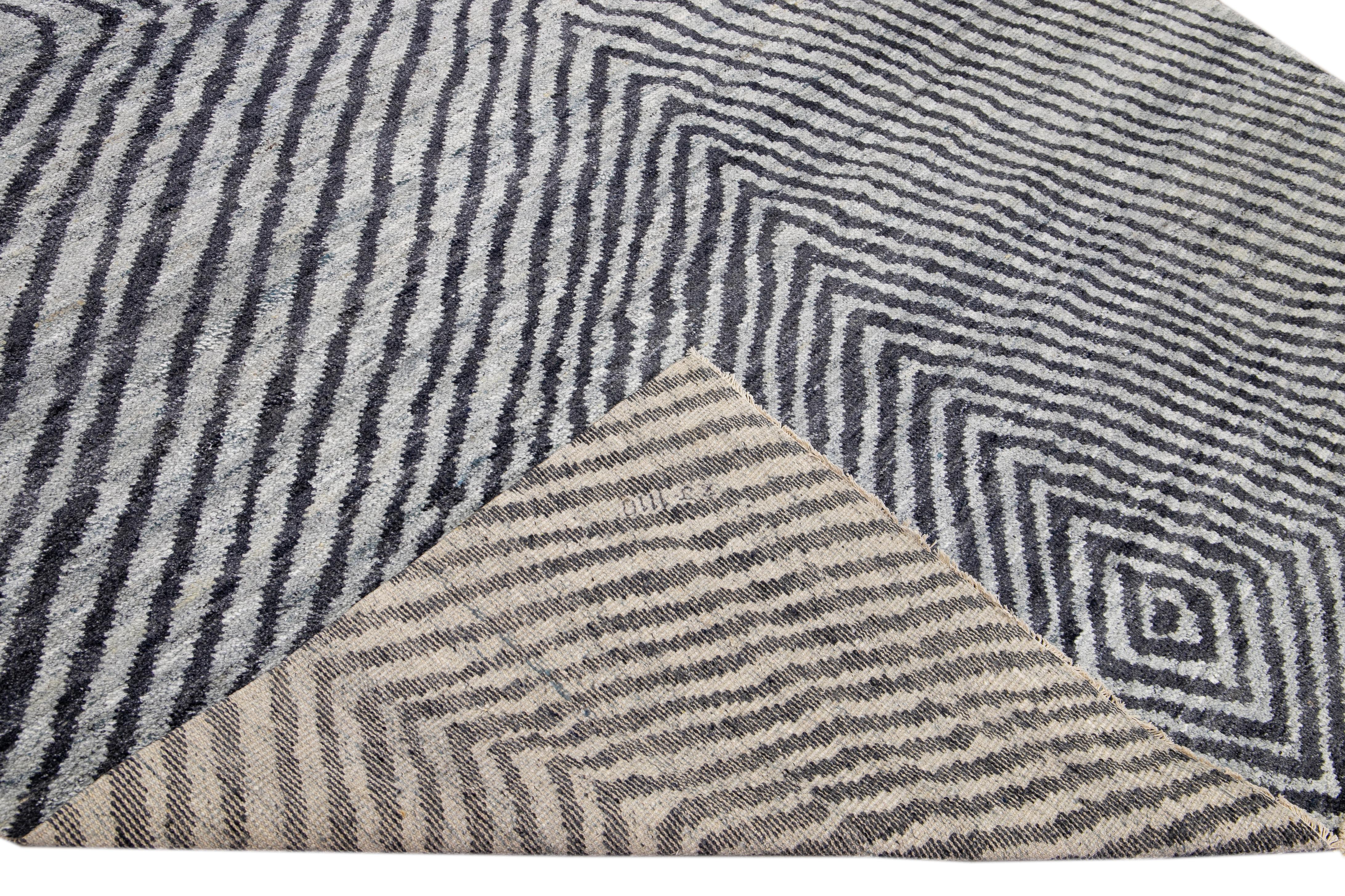 Beautiful Modern Vivien hand-knotted wool light gray field. This piece has gray accents in a gorgeous all-over seamless abstract design.

This rug measures 9' x 12'.
 
Our rugs are professional cleaning before shipping.