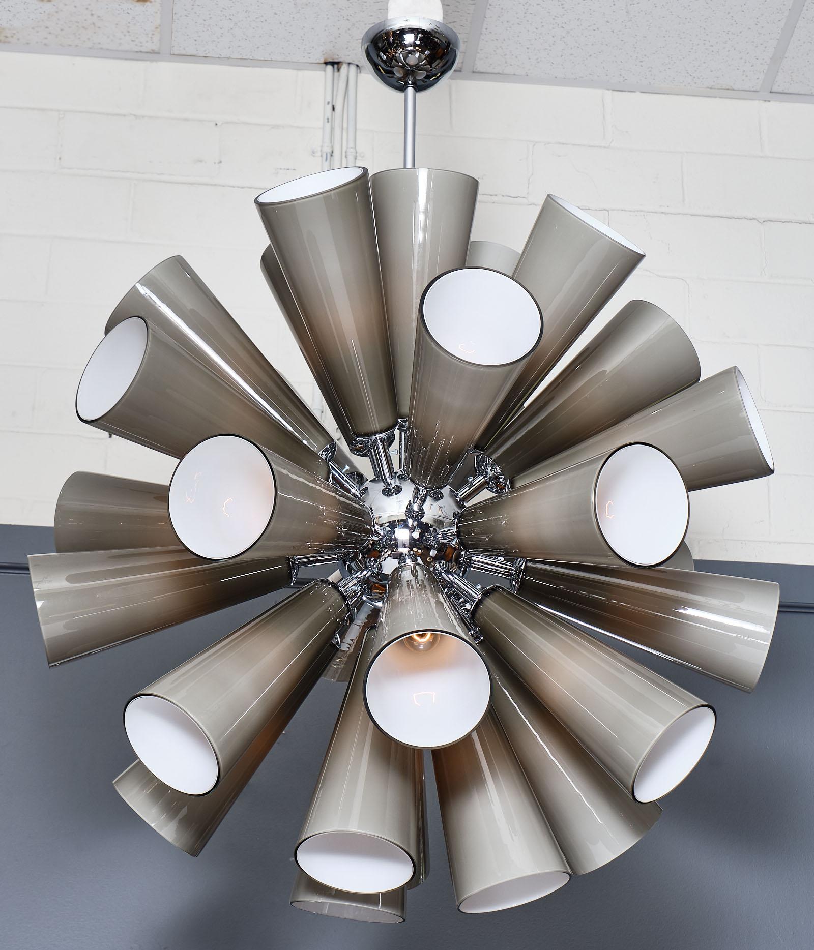 Murano glass gray sputnik chandelier featuring multiple blown glass components in conic shapes. Each glass piece has a double layer of white glass inside and gray outside, which gives the fixture a very smooth glow. The structure is chrome and has