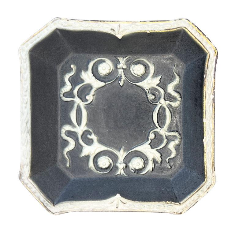 A lovely ceramic trinket dish or vide poche in a purple and gray glaze. This piece was created in Italy, and imported by the well-known importer of Italian ceramics, Pauls. It is square and made of a very heavy sturdy ceramic. It almost feels like