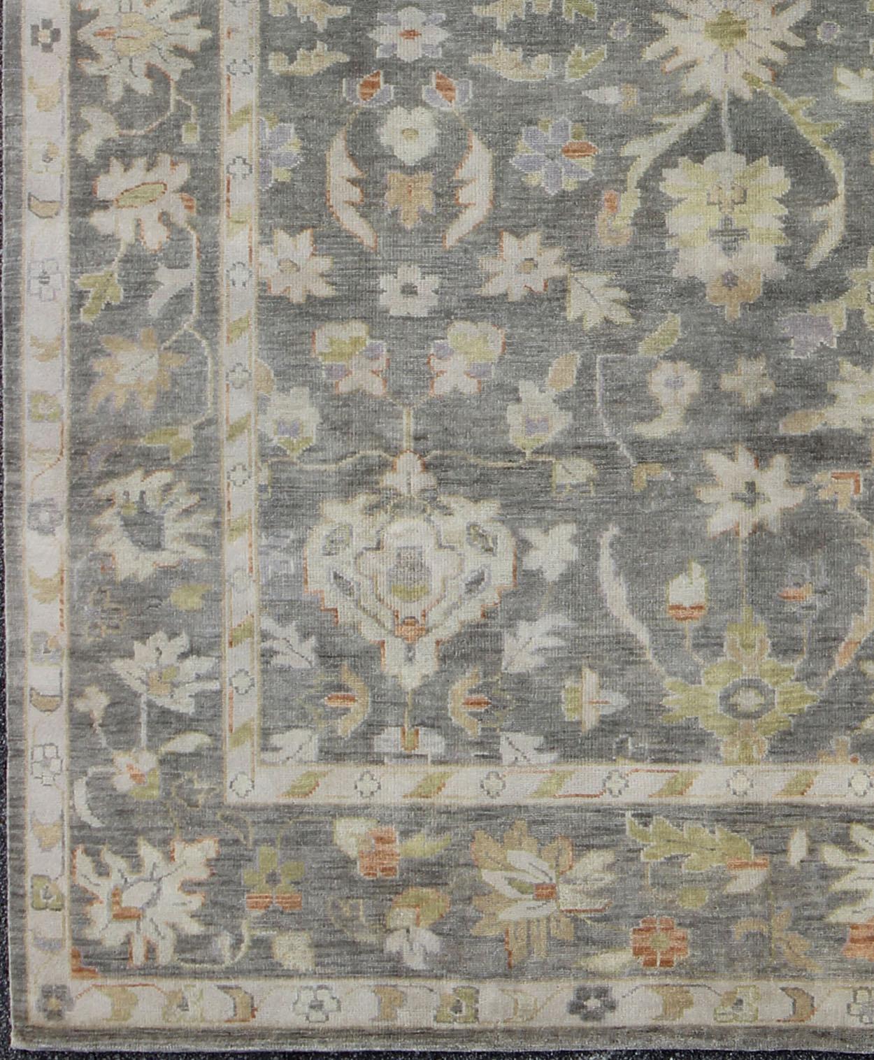 Indian Gray Oushak with All-Over Floral Design in Green, Taupe and Orange Accents For Sale