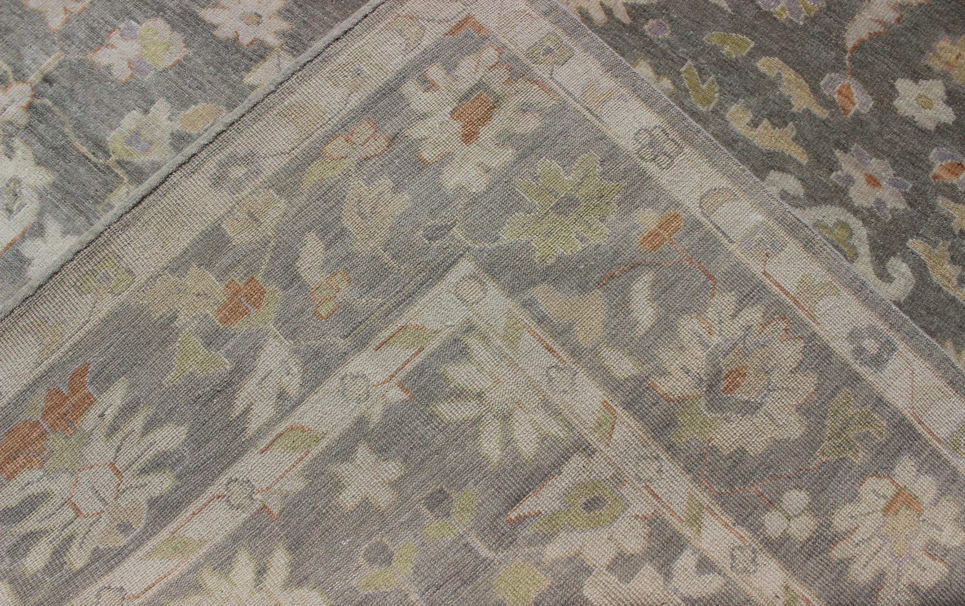 Contemporary Gray Oushak with All-Over Floral Design in Green, Taupe and Orange Accents For Sale