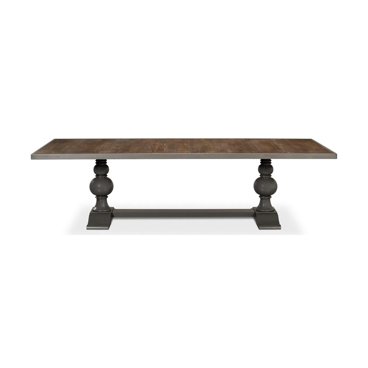 Dining Table with an inlaid reclaimed wood top that adds finesse to your dining area. Supported by a turned baluster double pedestal base, this table marries classic charm with modern style. The gray painted finish completes the look, creating a