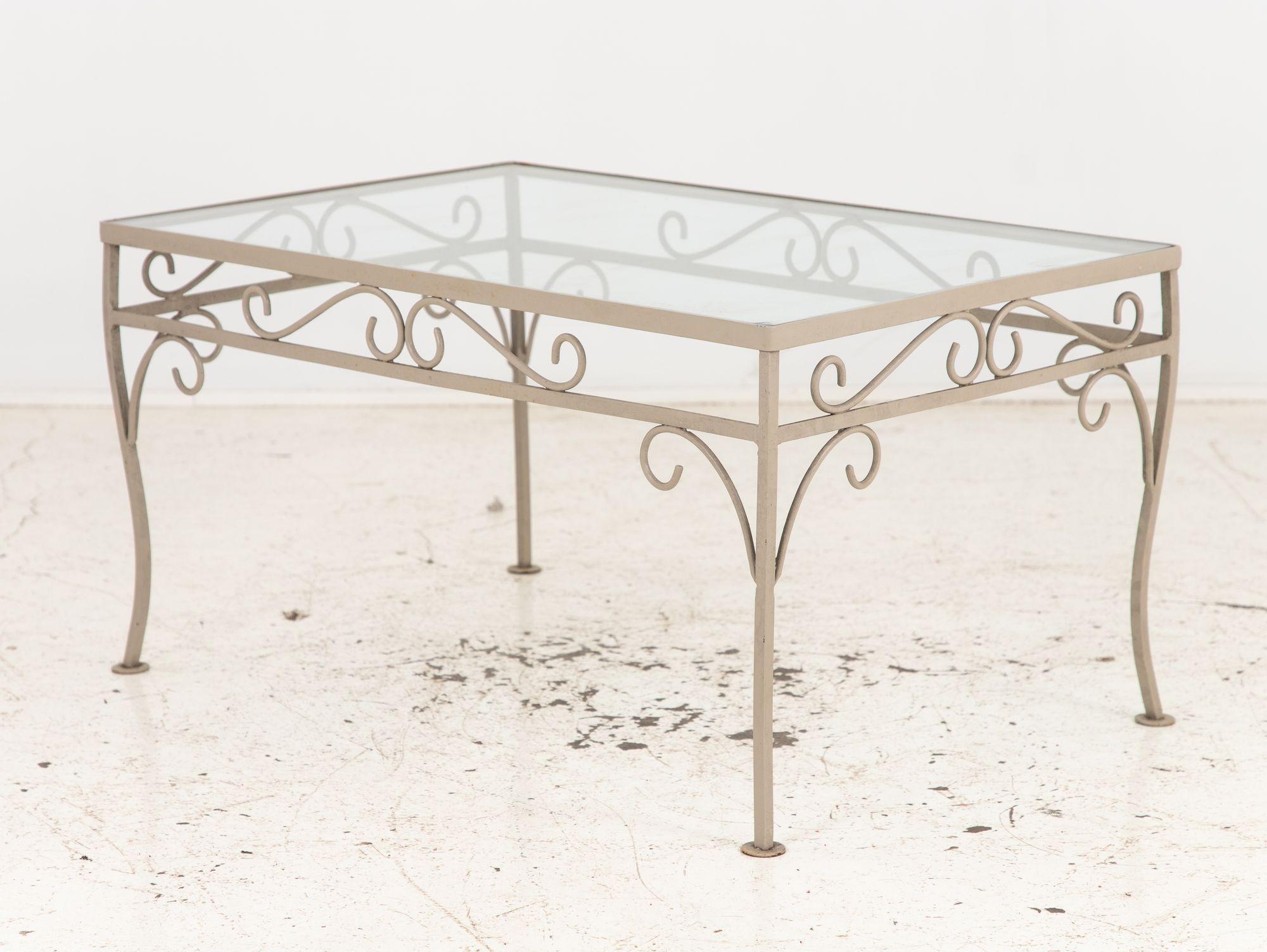 Elevate your garden oasis with this exquisite cocktail table, reminiscent of the Woodard style. Its gray-painted base exudes sophistication, embodying timeless elegance. Crafted with attention to detail, the cabriole legs evoke a sense of grace and
