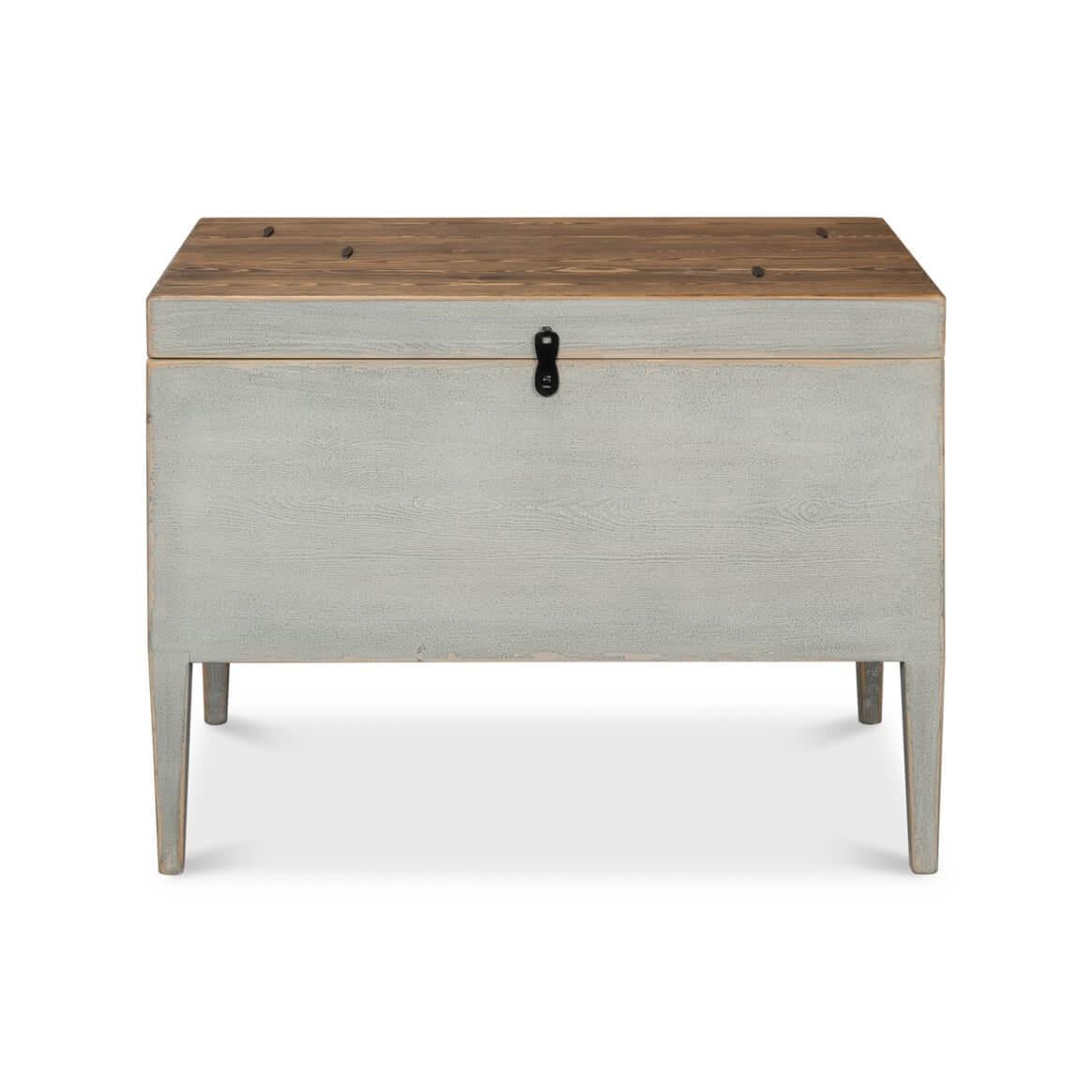 A rustic-style cityscape gray painted wooden trunk that exudes vintage charm and functionality. Constructed of a richly textured hardwood, evidenced by the pronounced grain, which suggests durability and natural beauty. 

The wood has a weathered