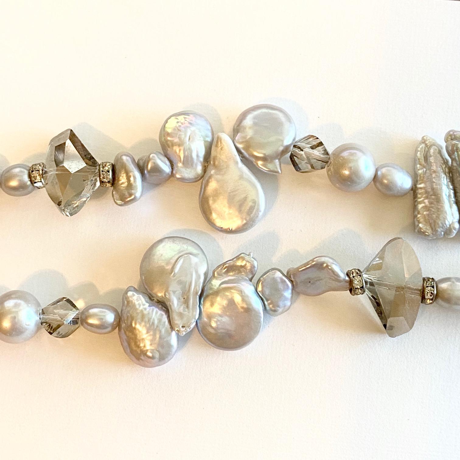 If you like genuine, cultured pearls and have a fun, unique style and love quality-this necklace is for you!! It has gorgeous, genuine, baroque pearls all around it with faceted genuine quartz beads! This gray pearls have a rich creamy color with