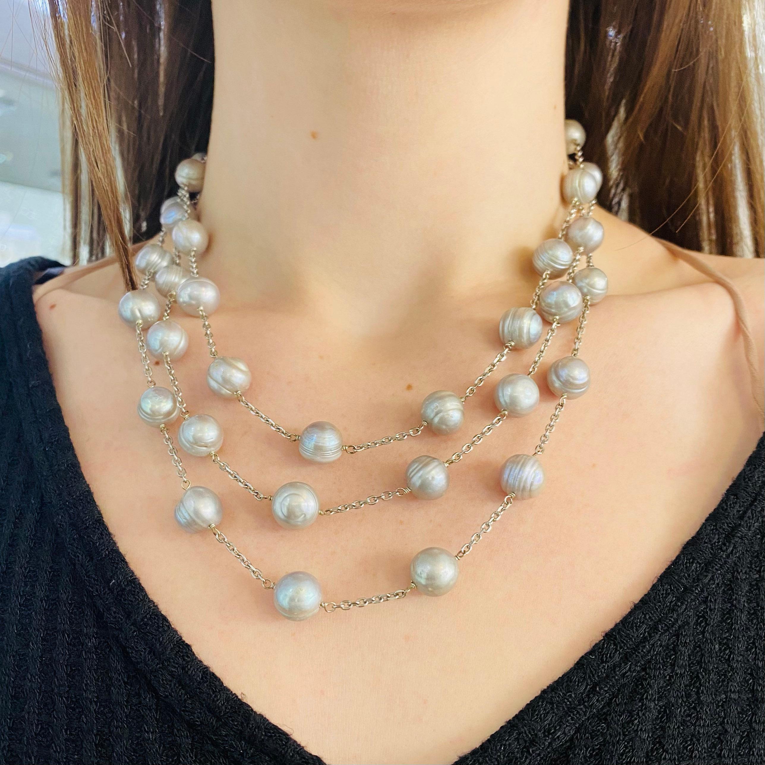 This is an amazing freshwater pearl necklace that has gray pearls.  The three strands are tapered in length so that they hang perfectly on your neck and is designed so that the pearls are spaced in a lovely design. This is a very striking necklace