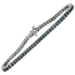 Bracelet tennis en or blanc 14 carats serti d'un saphir gris taille princesse