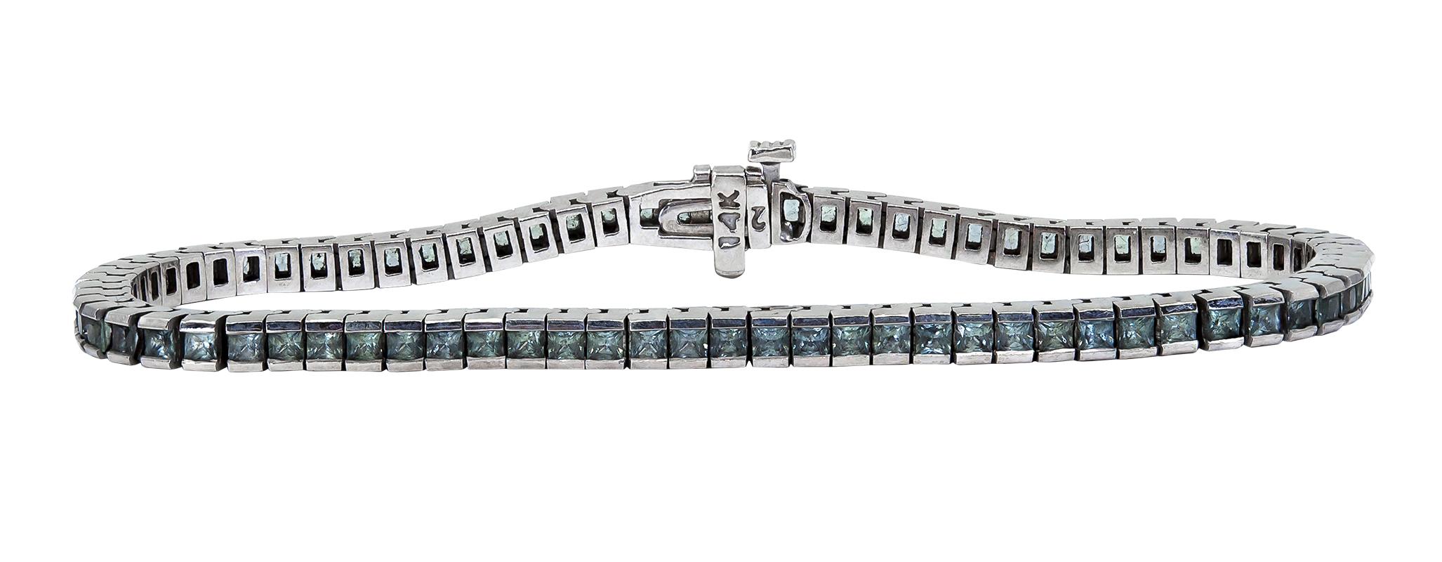Women's Gray Princess Cut Sapphire Tennis Bracelet set in 14 Karat White Gold For Sale