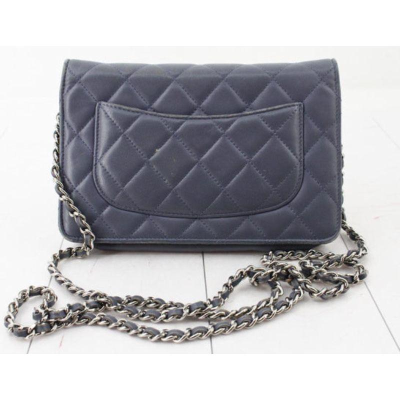 Gray quilted Lambskin leather Chanel Wallet On Chain with silver-tone hardware, interwoven chain and leather shoulder strap, interlocking CC logo adornment at front, single zip pocket flap underside, single slit pocket under front flap, dual