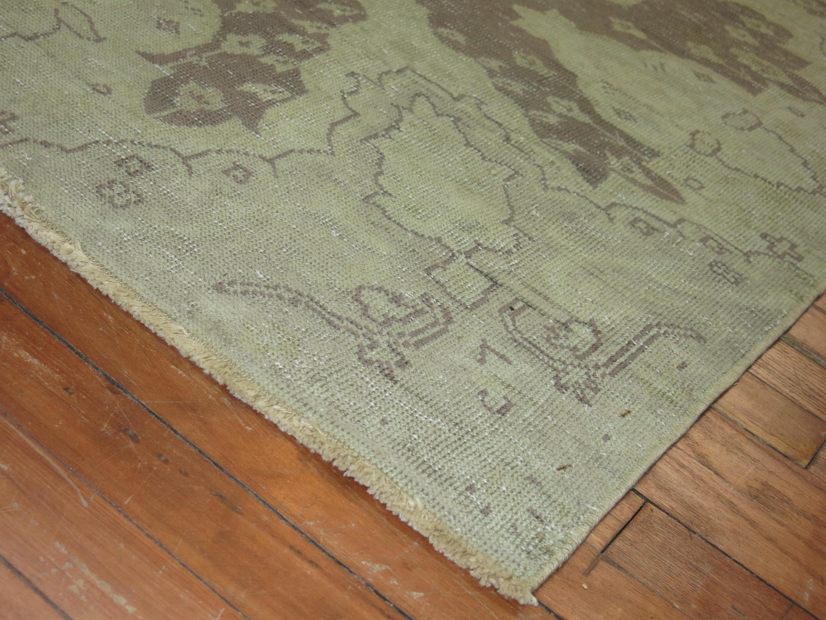 Room size early 20th century Shabby Chic antique gray field Oushak rug.
We love the natural wear on this rug because it shows a real taste of the life that it's already lived.