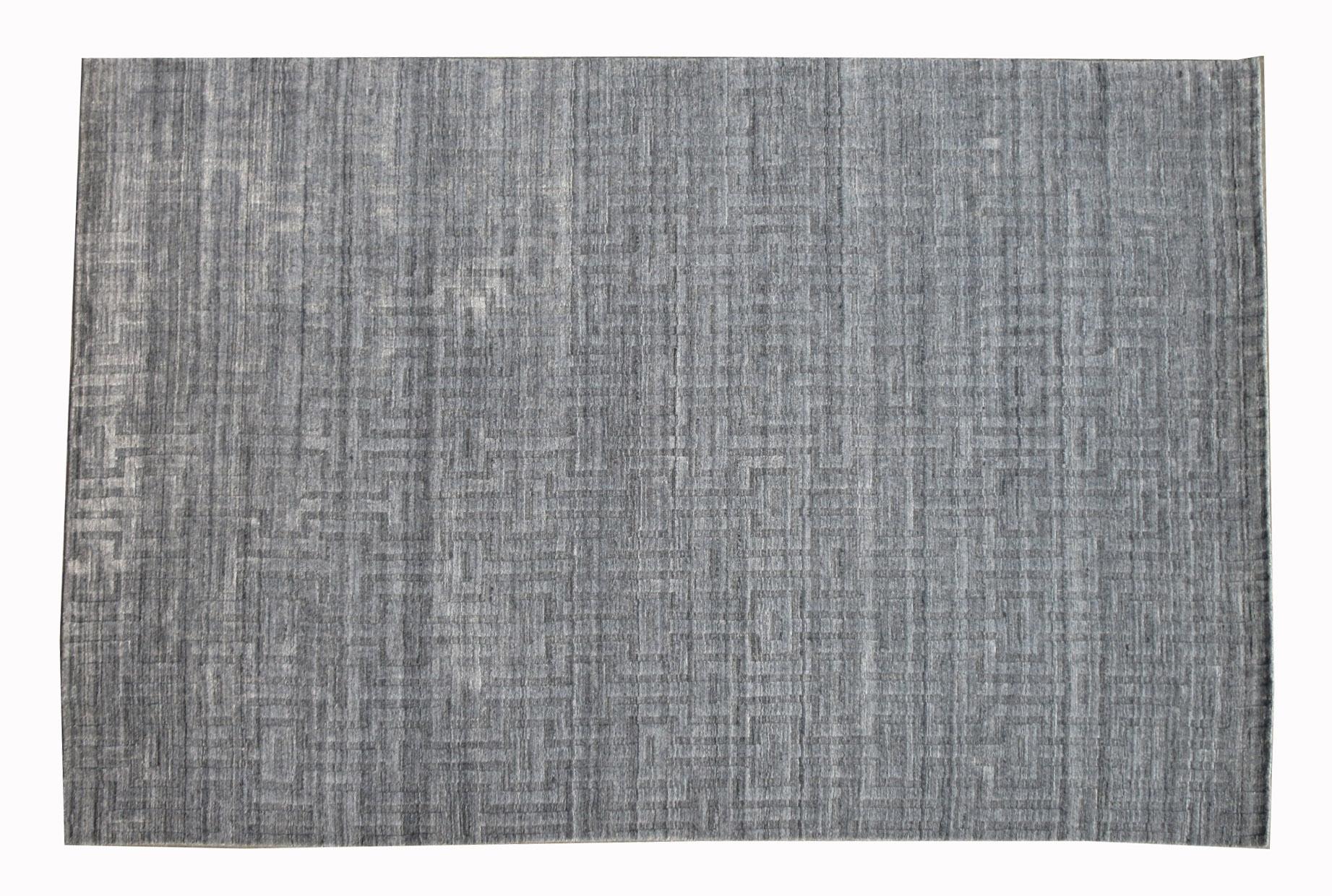 Handmade silk pile on a cotton foundation. 

Geometric texture

Origin: India

Field color: light-grey.