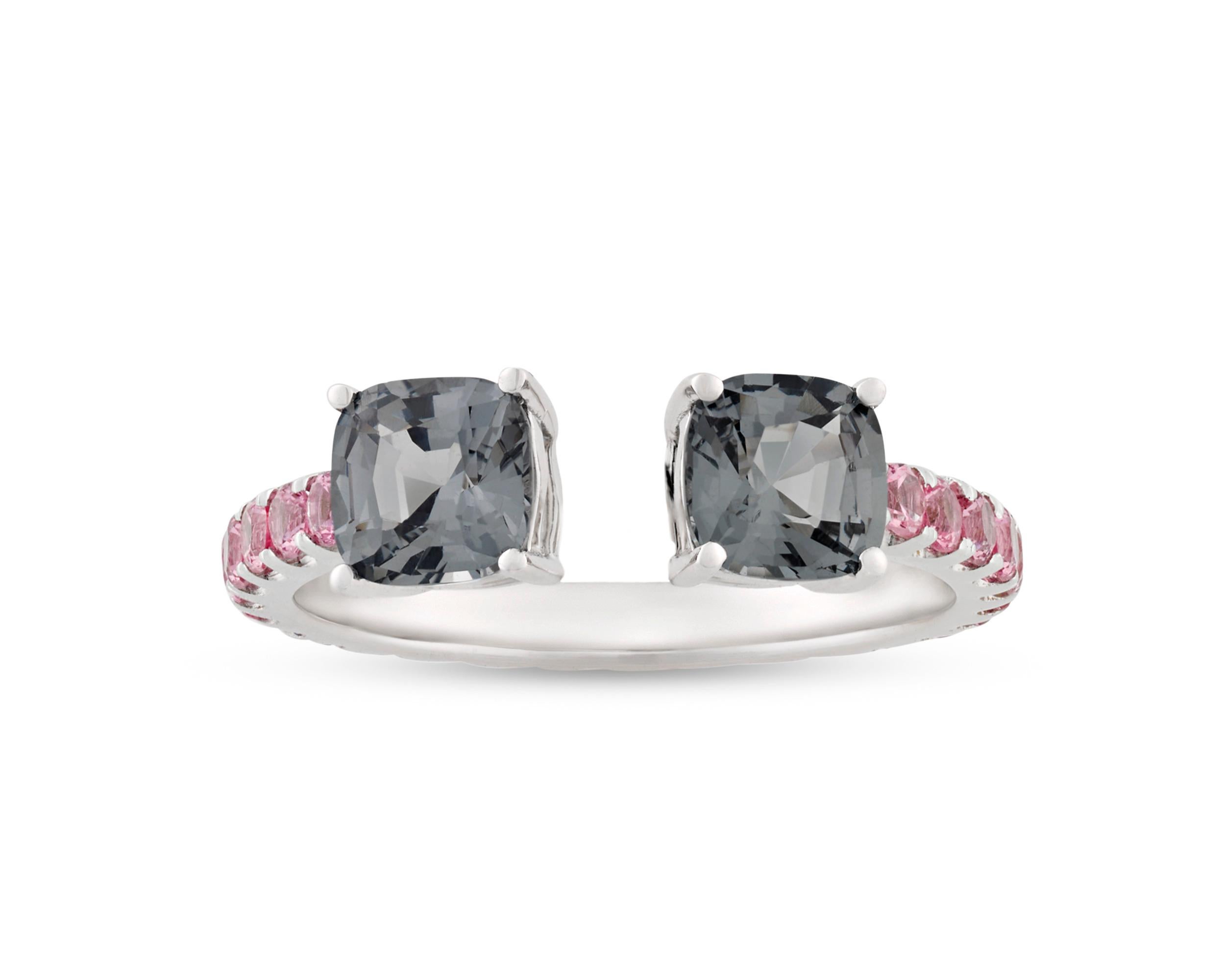 A pair of deep gray spinels weighing a combined 1.48 carats sit opposite each other in this one-of-a-kind wrap ring. The richly colored stones are contrasted by a collection of pink spinels totaling 0.92 carat set within the 18K white gold shank.