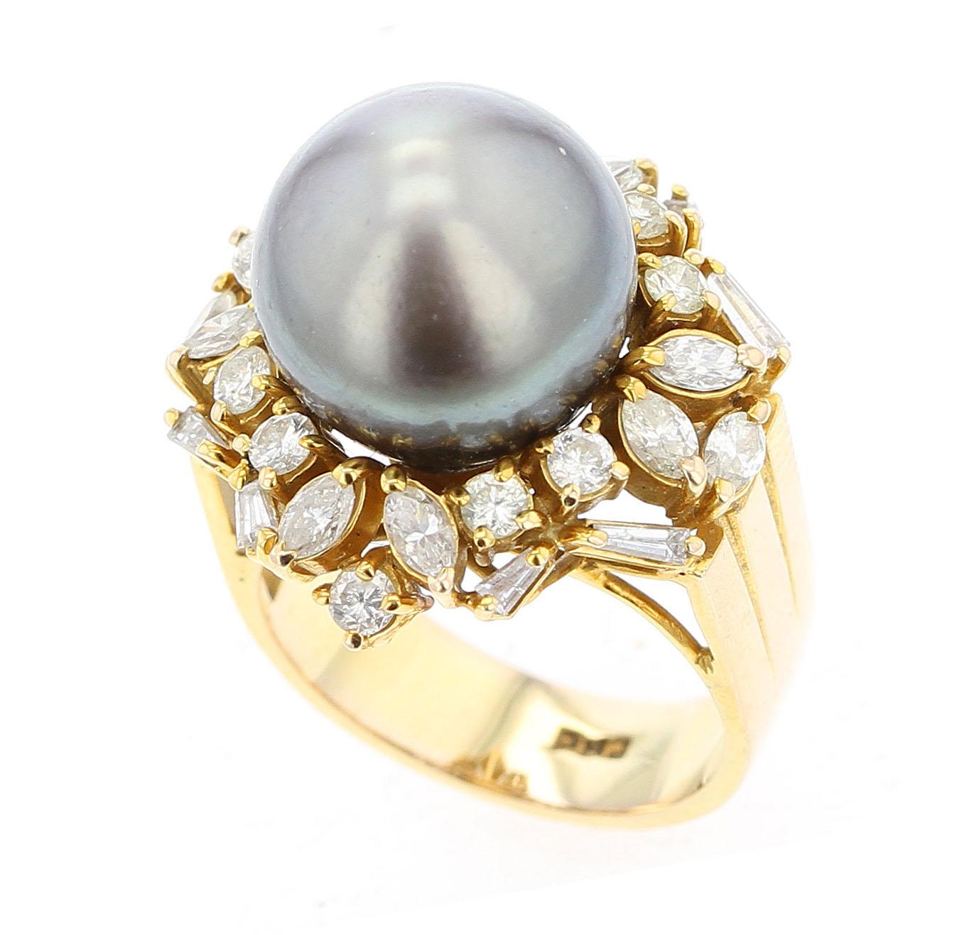 A bold ring consisting of Gray Tahitian Cultured Pearl (appx. 12.7MM) set with 10 round diamonds, 10 marquise diamonds, and 8 baguette diamonds. Ring Size US 5. Stamped 585. 14K Yellow Gold.