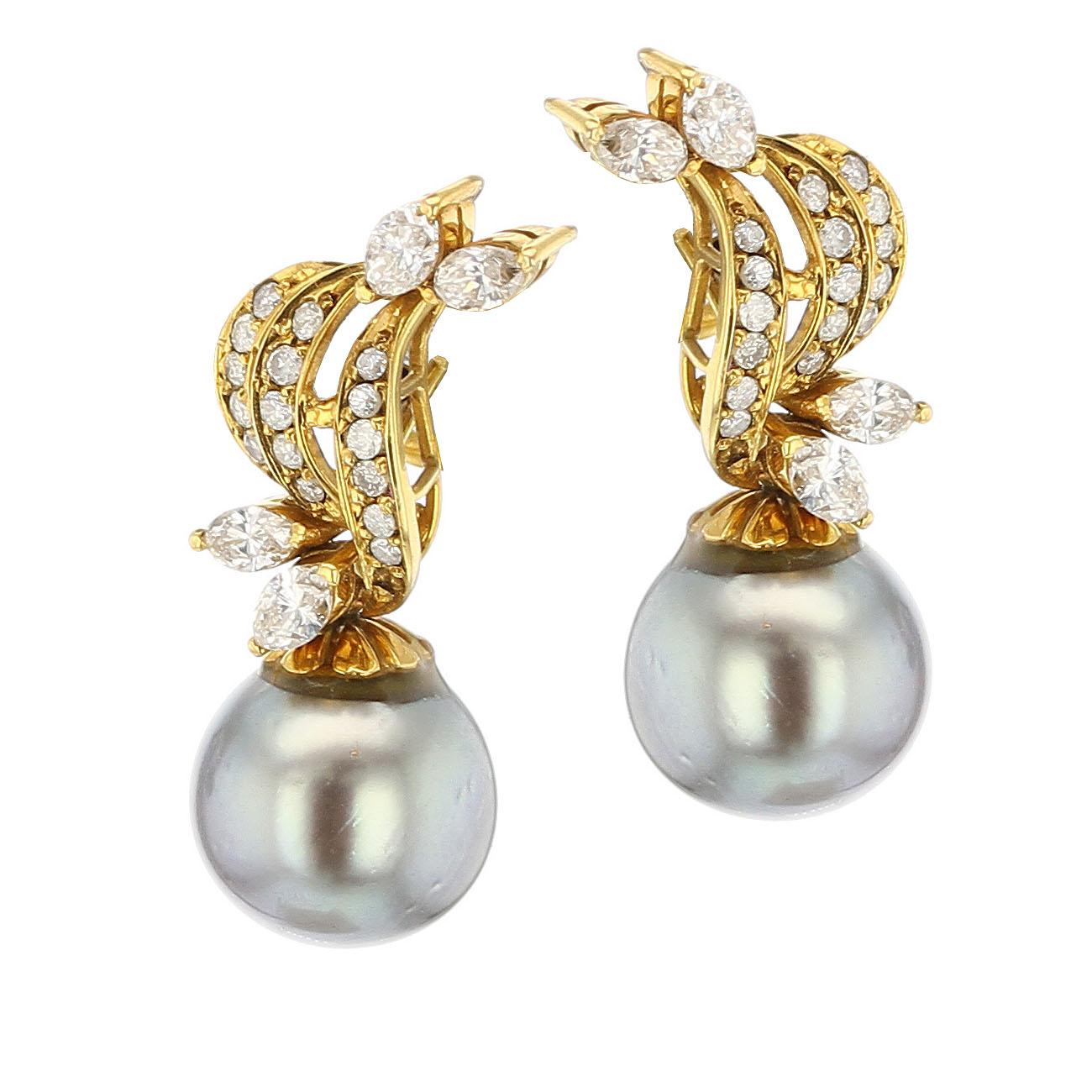 A stunning and practical pair of Gray Tahitian Cultured Pearl (appx. 11.8 MM) and Diamond Earrings in 14K Yellow Gold. The pearl is detachable, so the earrings can be worn with or without the pearl. In each earring, there are 17 round diamonds and 4