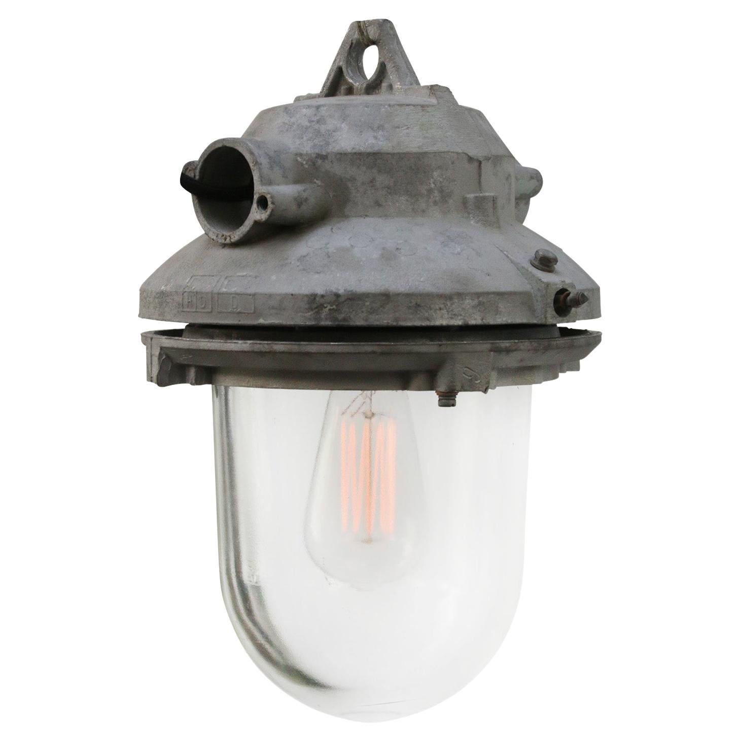 Lampes à suspension industrielles grises vintage en verre transparent en vente