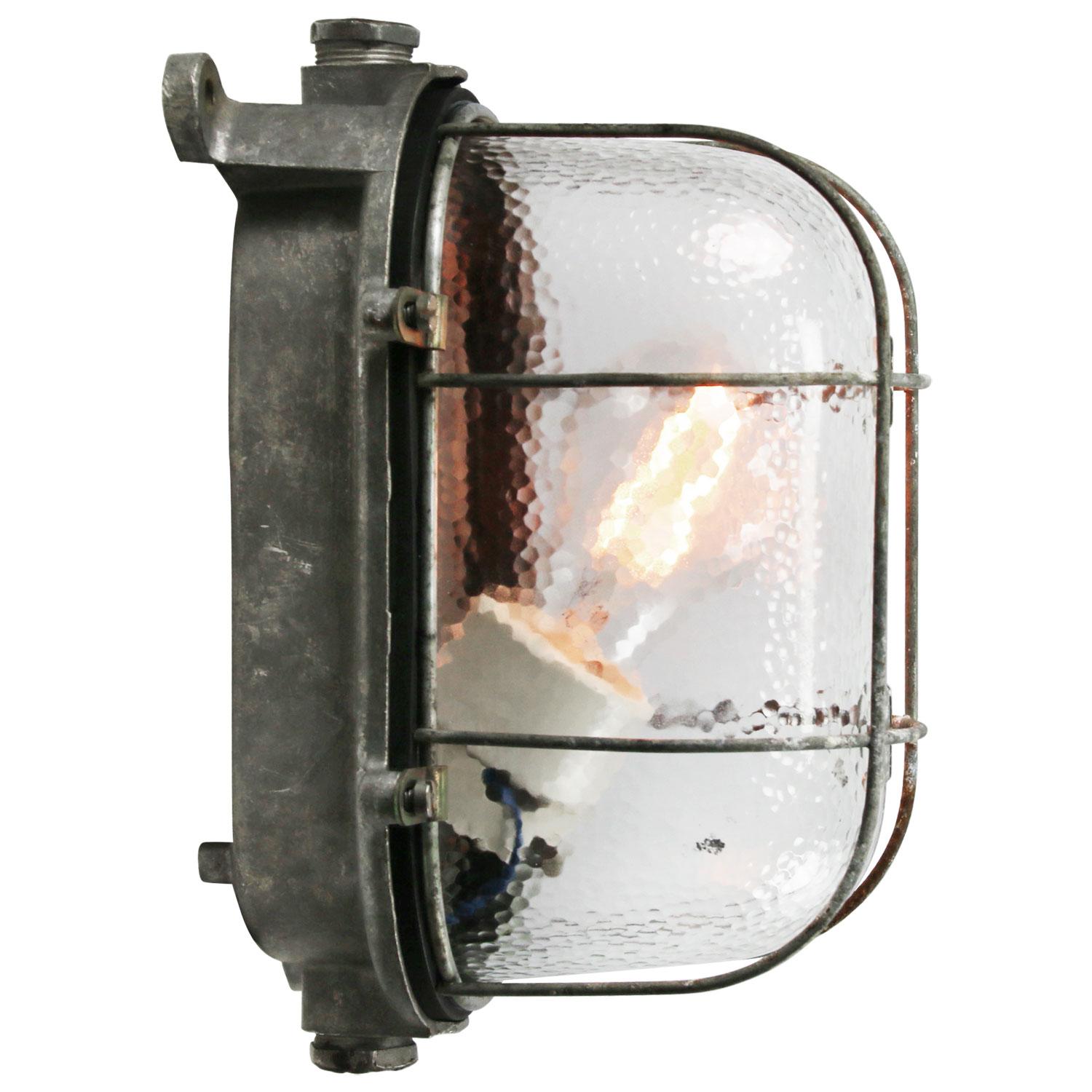 Industrial wall, scone or ceiling lamp
Cast aluminum, frosted glass + metal cage

Weight: 1.40 kg / 3.1 lb

Priced per individual item. All lamps have been made suitable by international standards for incandescent light bulbs, energy-efficient
