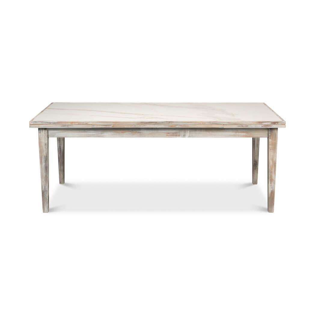 The table is a versatile piece that transforms from an 81-inch table to a 120-inch long dining table. This unique extendable design makes it a perfect choice for various occasions and space requirements.

Featuring a marbleized porcelain inset in