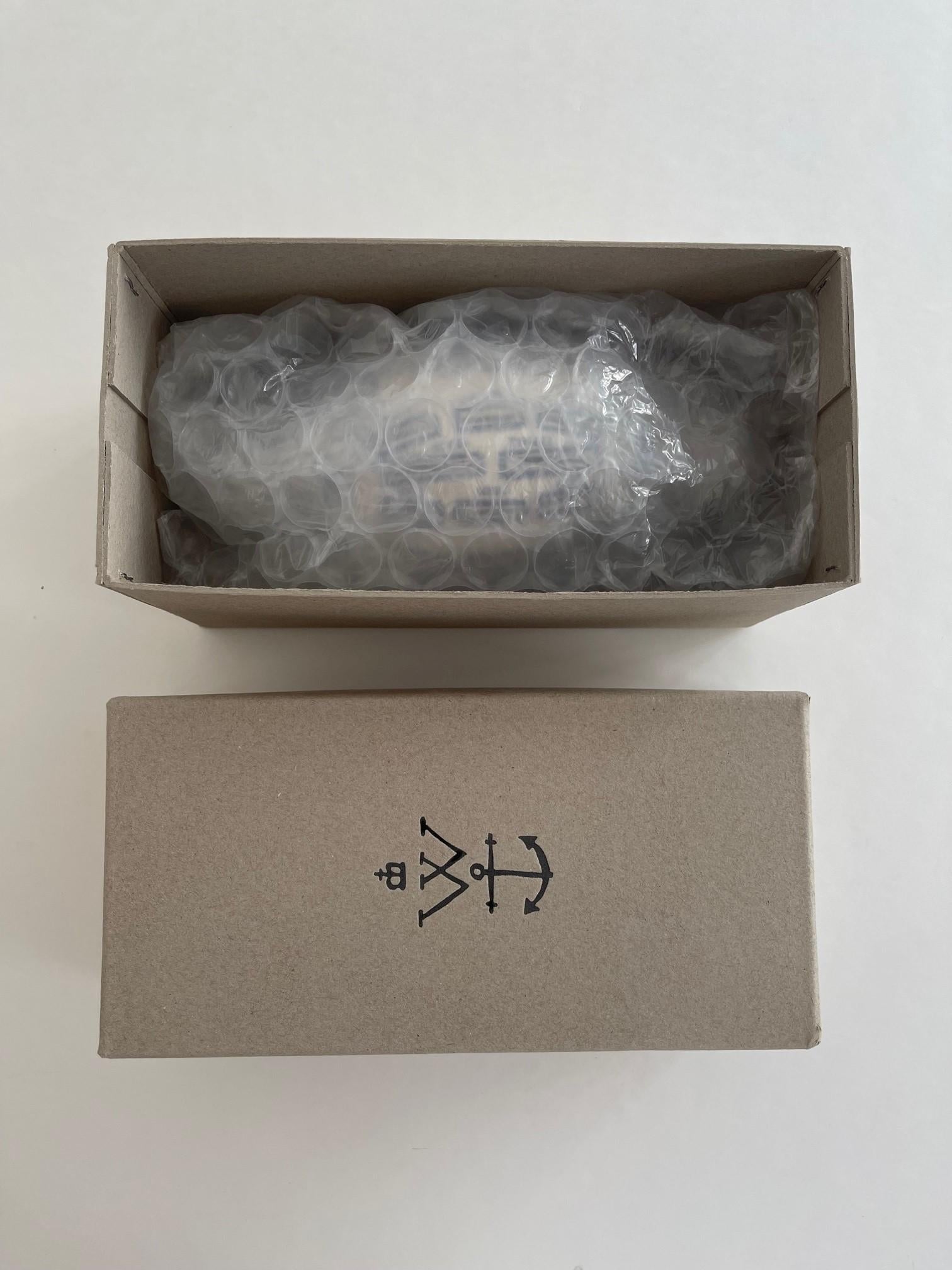 Painted and glazed ceramic multiple with rubber stopper, 2019, with the Artist's logo on the underside, from the edition of unknown size, contained in the original Serpentine Gallery box.