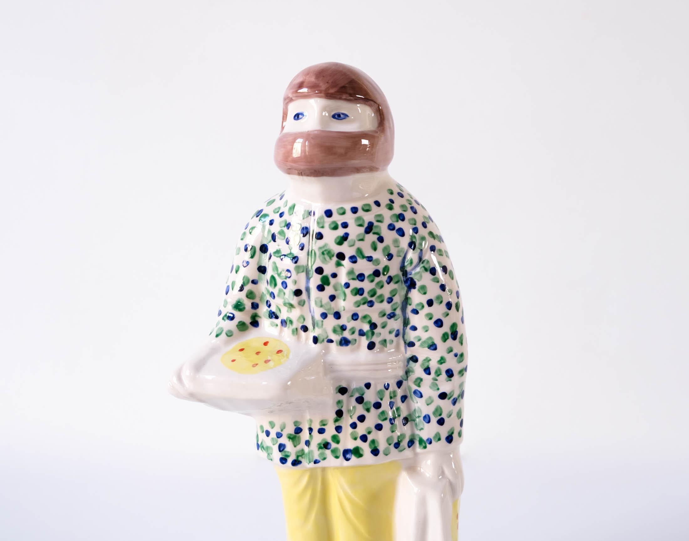 A Grayson Perry glazed ceramic hand painted Key Worker Staffordshire Figure, which is part of his 