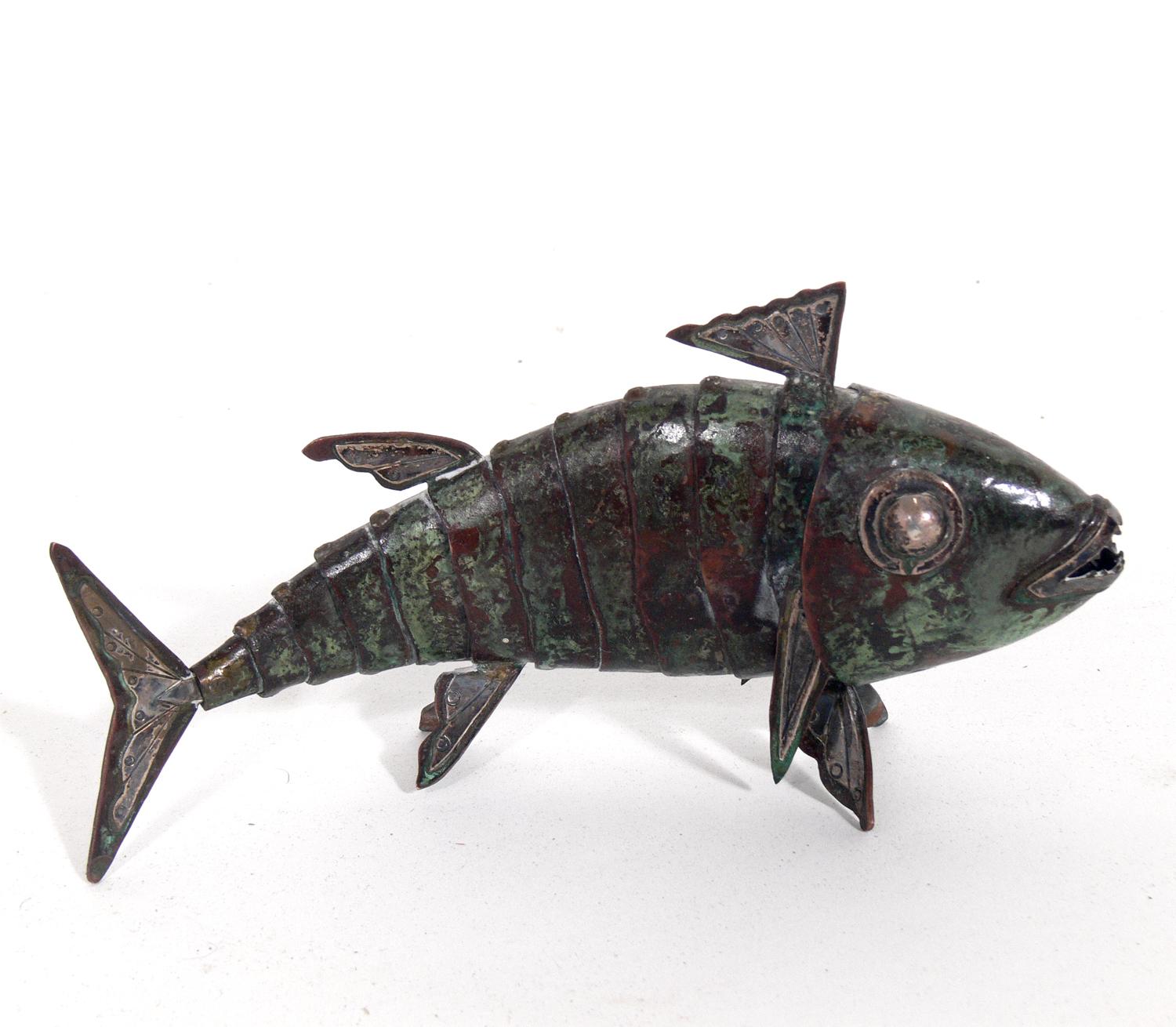 Articulated fish sculptures, handmade by Graziella Laffi, Peru, circa 1950s. Executed in hand-hammered copper and sterling silver. Wonderful original verdigris patina. The larger fish measures 6.25