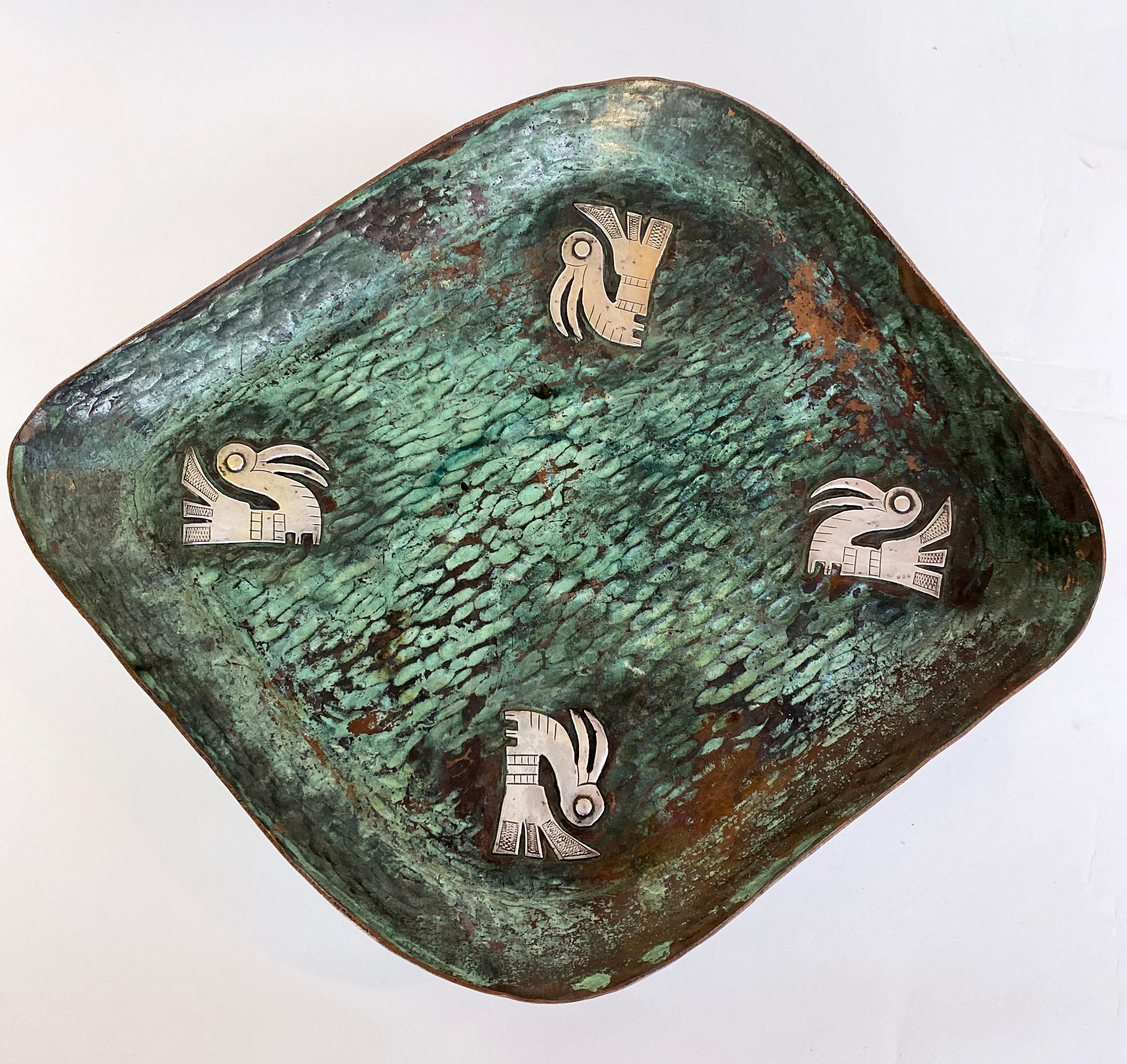 Fabulous hand forged Graziella Laffi Copper and Sterling Tray with four birds. Masterfully created.
Graziella Laffi, often referred to as the “Spratling of Peru” designed and made exceptional silver hollowware, trays and exquisite jewelry pieces in