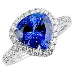 GRC zertifizierter kornblumenblauer Tansanit 18K Goldring mit Diamanten