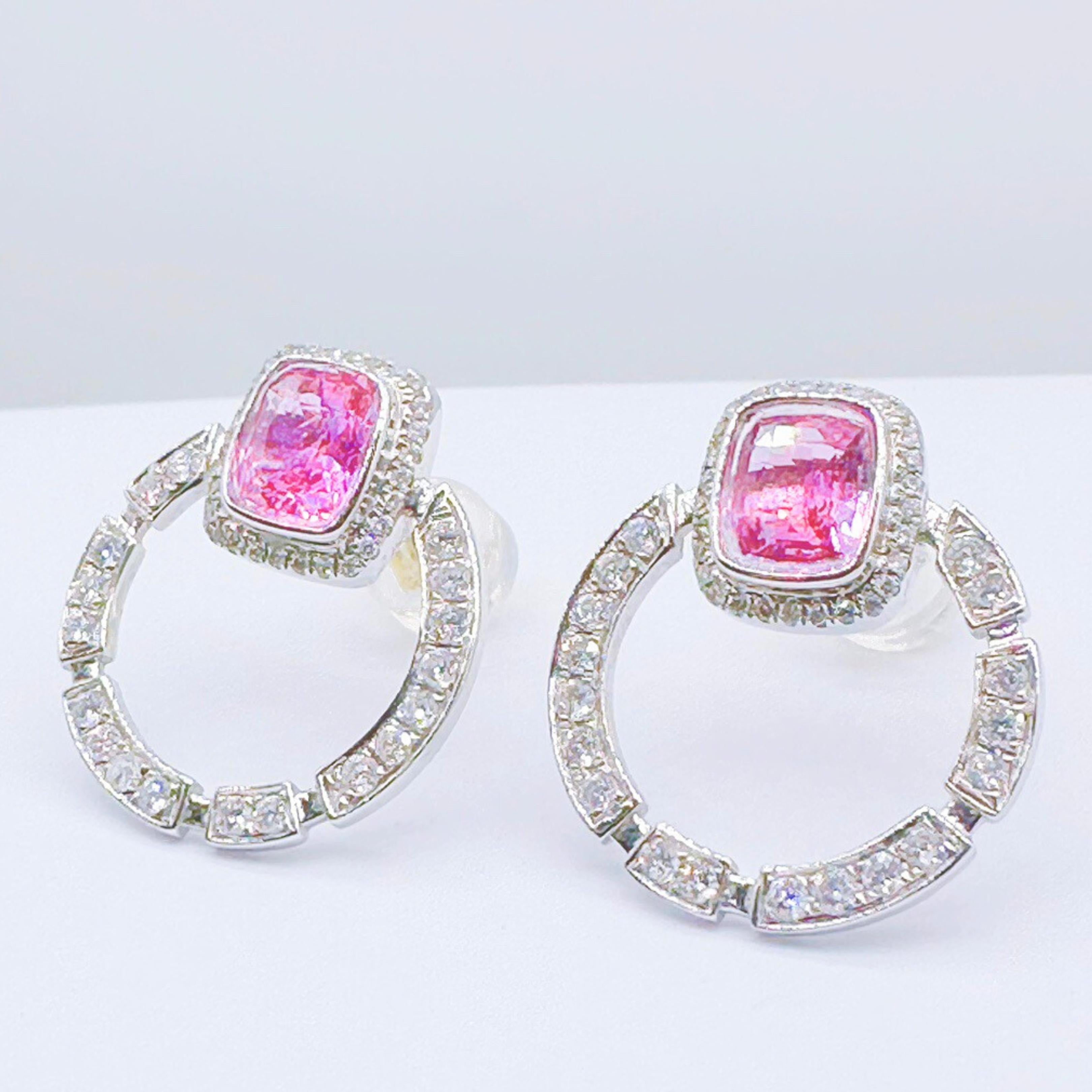 2 Padparadscha Sapphires - 1.14 CT
18K Gold - 2.94 GM

GRC Certified